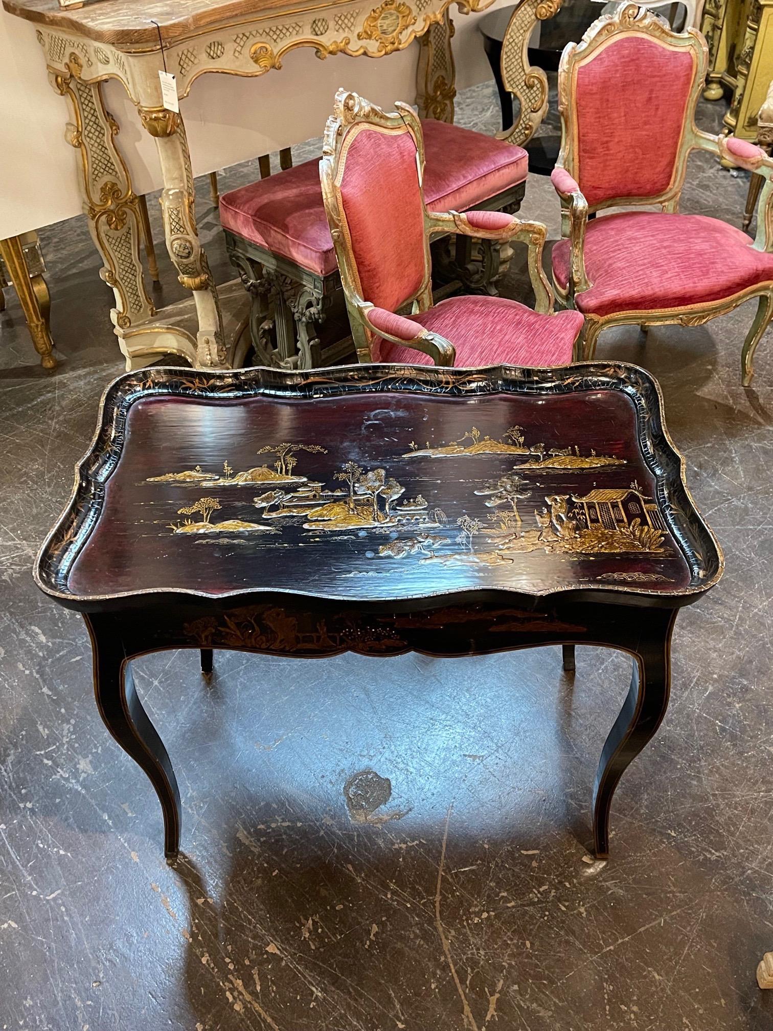 Stylish 19th century English lacquered side table with hand painted Chinoiserie designs. A very fine accent piece for a beautiful home! Lovely!