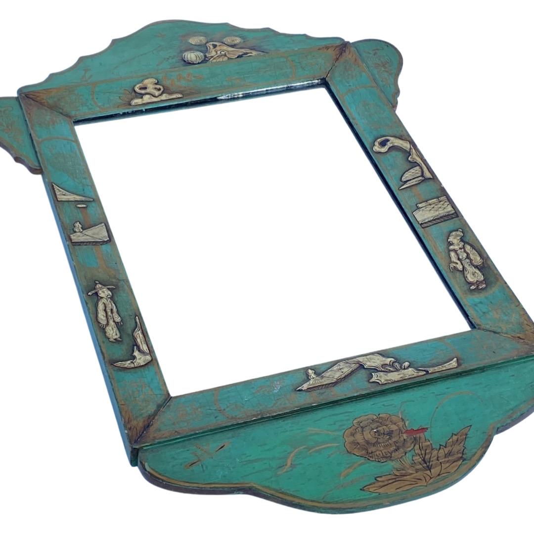 Late 19th Century to 1900s English mirror. Hand painted with raised Chinoiserie details. Beautiful green tone.