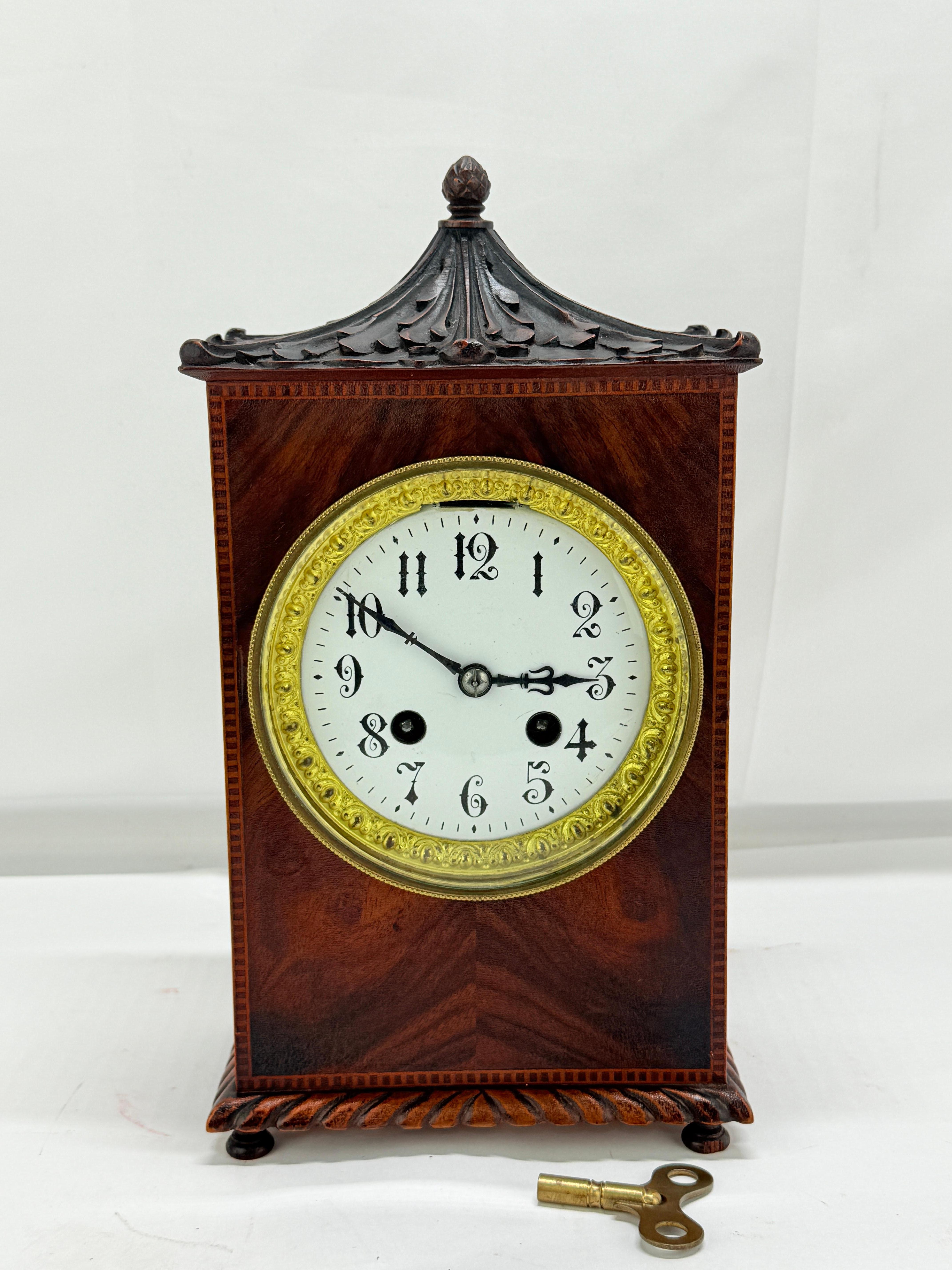 Late 19th Century English Chinoiserie Revival Mahogany Pagoda-Top Mantel Clock with Gilt Bronze Mounts

An elegant and finely crafted English mantel clock, dating to the late 19th century, notable for its integration of Chinoiserie motifs within a