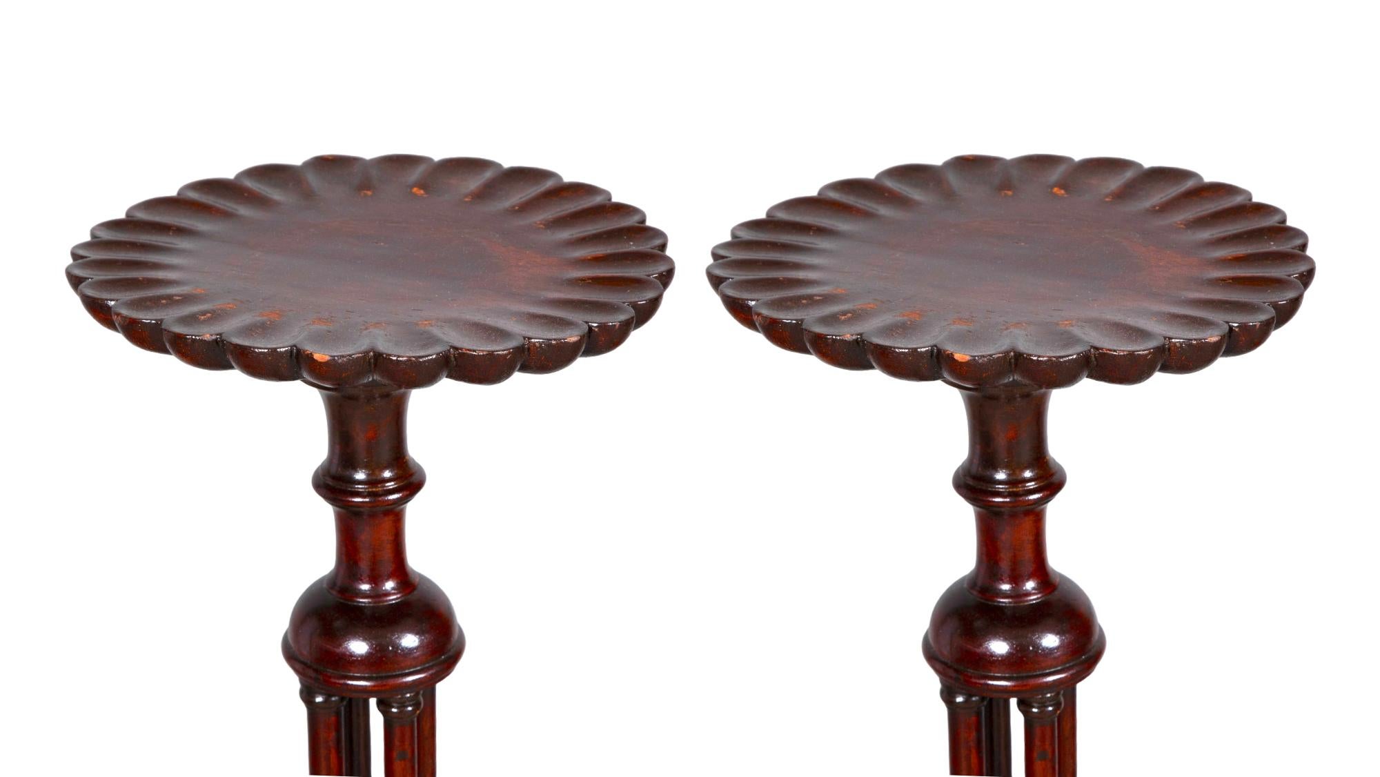 Immerse your space in the timeless elegance of the late 18th Century with this exquisite pair of English Chippendale Style Mahogany Wood pie cross design top and a Tripod Foot Candle Stands / pedestals. Each stand is a masterpiece of craftsmanship,