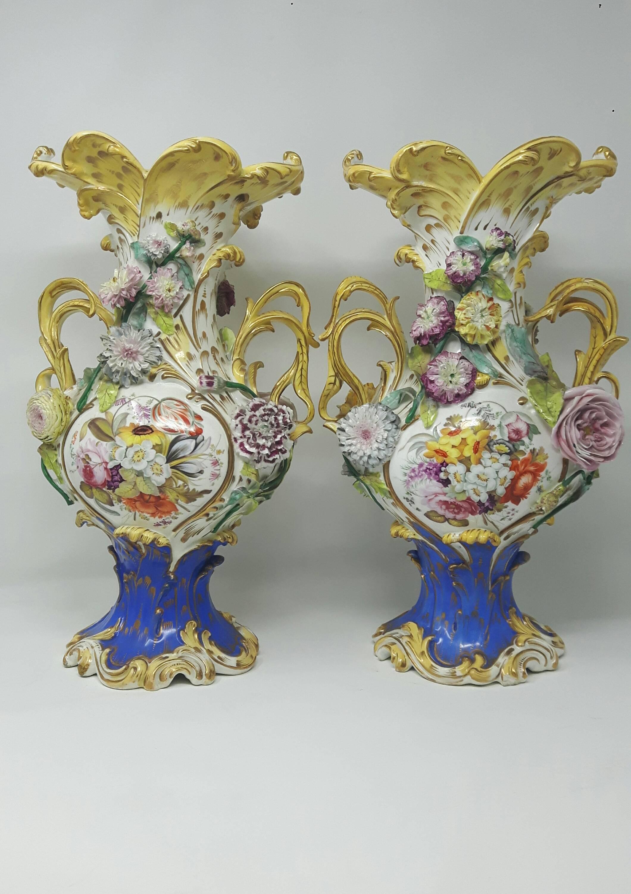 Pair of 19th century Coalport vases encrusted with finely modeled flowers and branches.