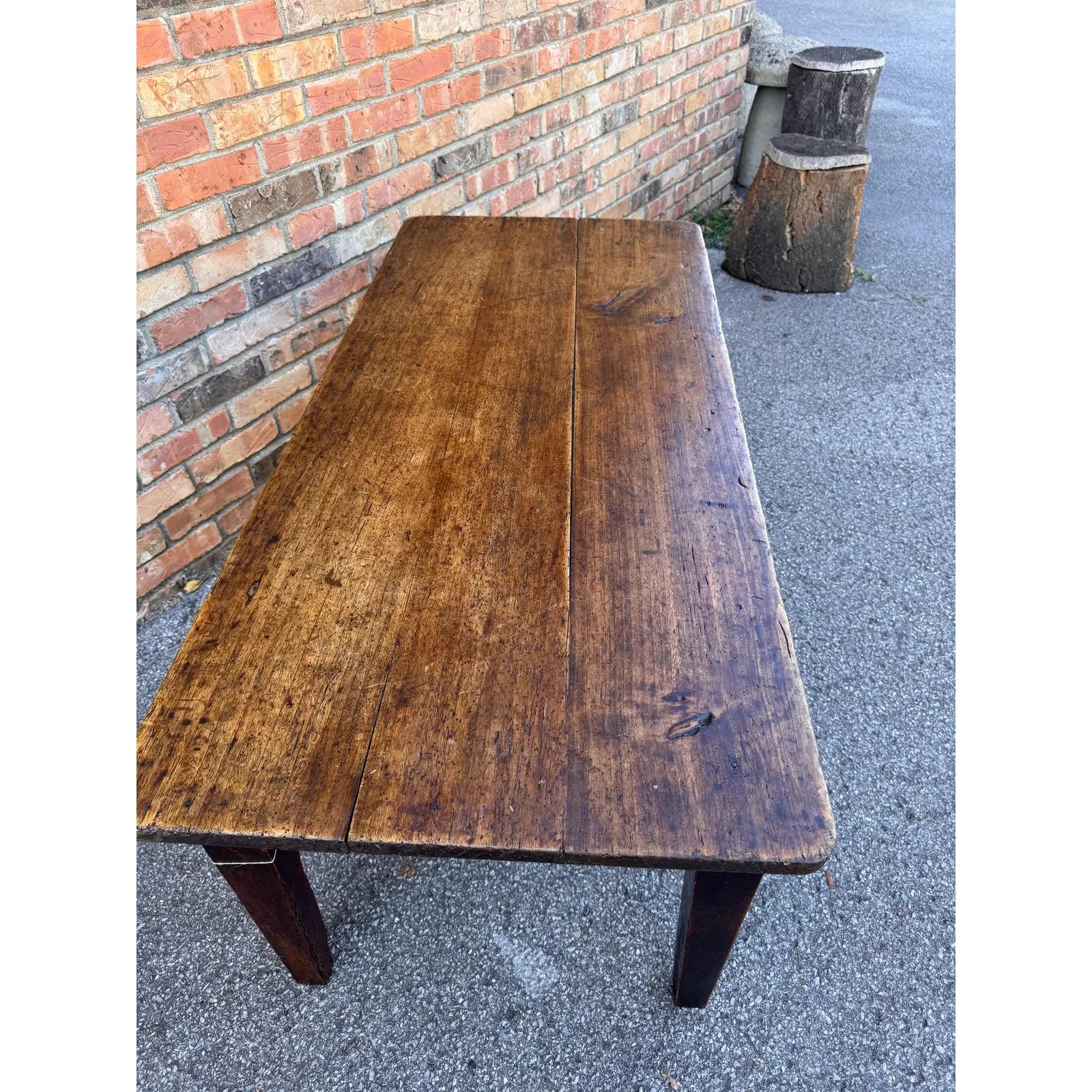 This is an 18th Century French Coffee Table. The top is walnut and it truly shows its walnut color patina and beauty. These tables were originally stand up work tables that we cut down to make very unique coffee tables very heavy and sturdy.