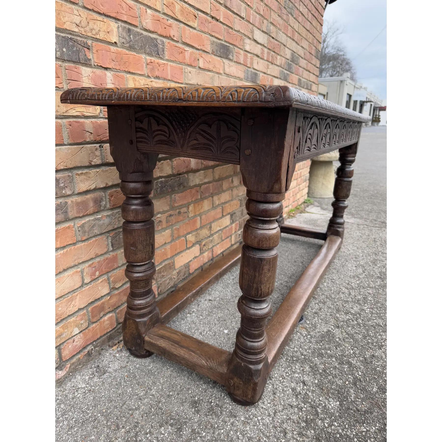 Early 19th Century Welch Serving Table in Oak with lovely patina. Resting on 4 nicely turned and chunky legs as well as amazing carving around the perimeter. A stunning conversation piece, could be used as a serving table, sofa or console table.