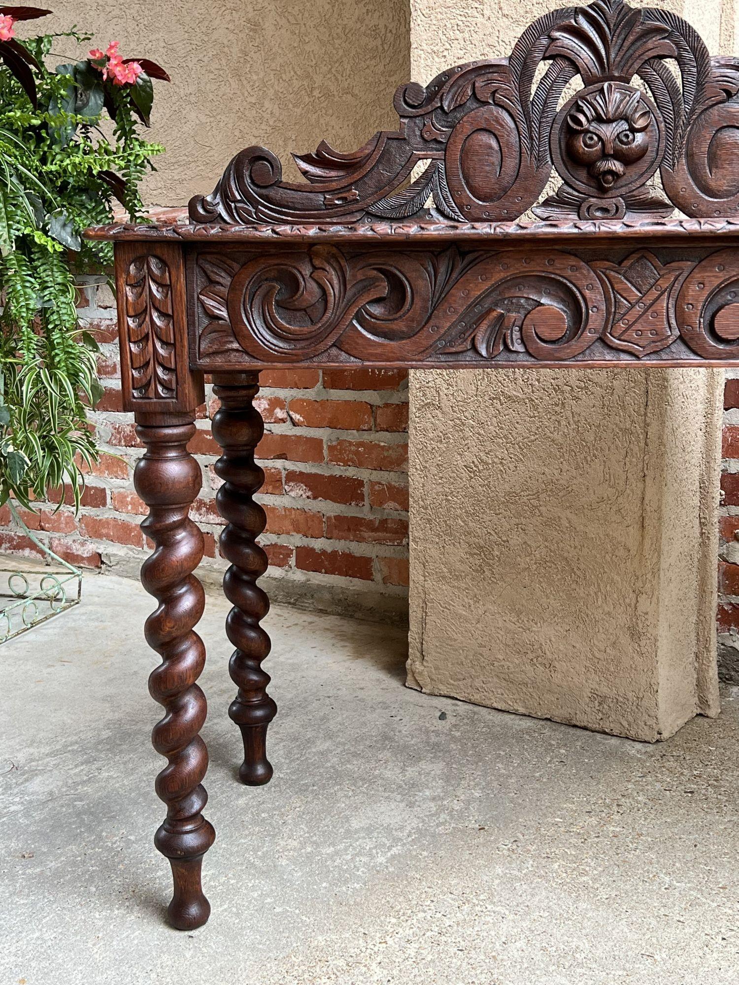 19th century English Console Foyer sofa table Barley Twist Carved Oak Renaissance Style.
 
Direct from England, here’s a perfect size table, versatile as a foyer, console, sofa table, with fabulous carved features that are sure to make it a focal