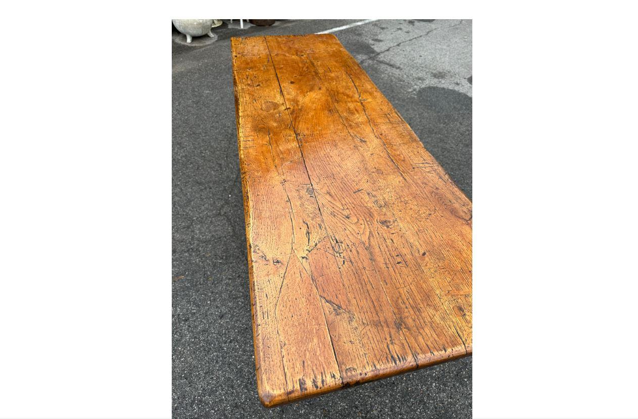 This is a very unique English console table! This piece dates to the 19th century, and has gorgeous patina! It sets on a trestle base with an extremely unusual and interesting design. Stunning natural design and age! This would make a show stopping