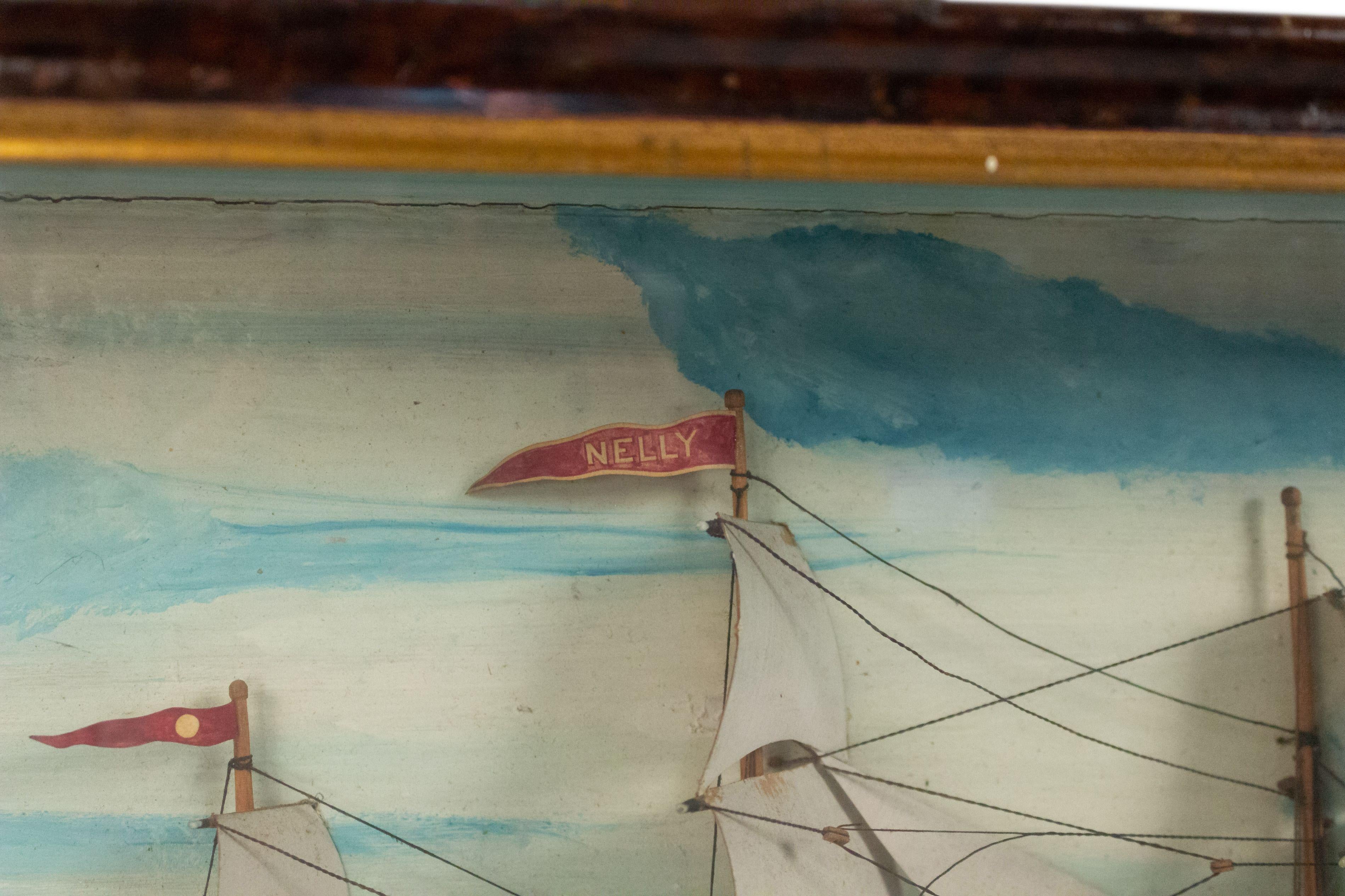English Country (19th Century) painted diorama wall plaque with clipper ship Nelly, with small paddle boat and light house in faux tortoise painted frame.
 