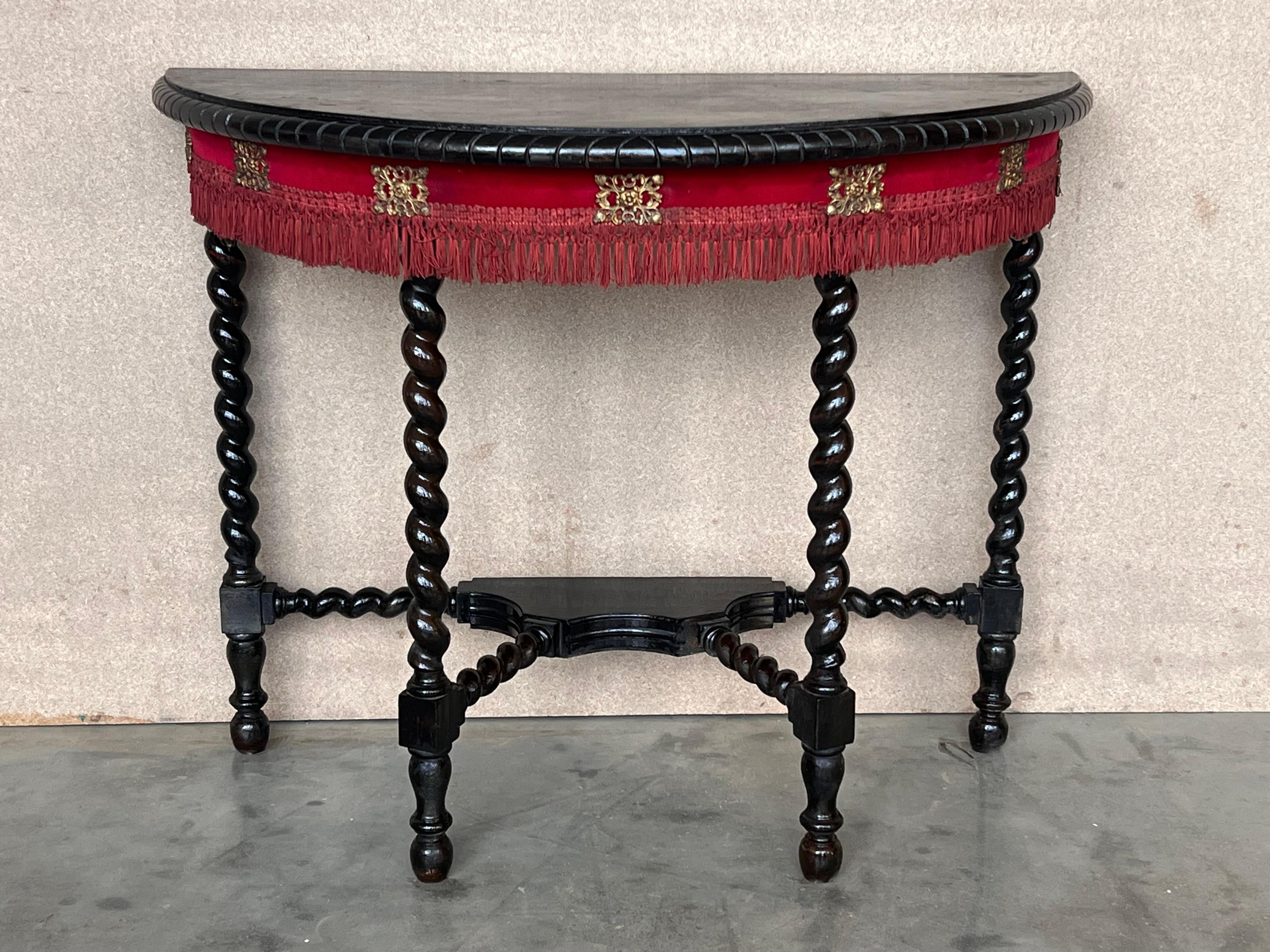 19th century Spanish demilune table made from walnut. The top has a beleveled merge The table is supported on hand-turned Solomonic shaped legs  joined by simple curved stretcher.