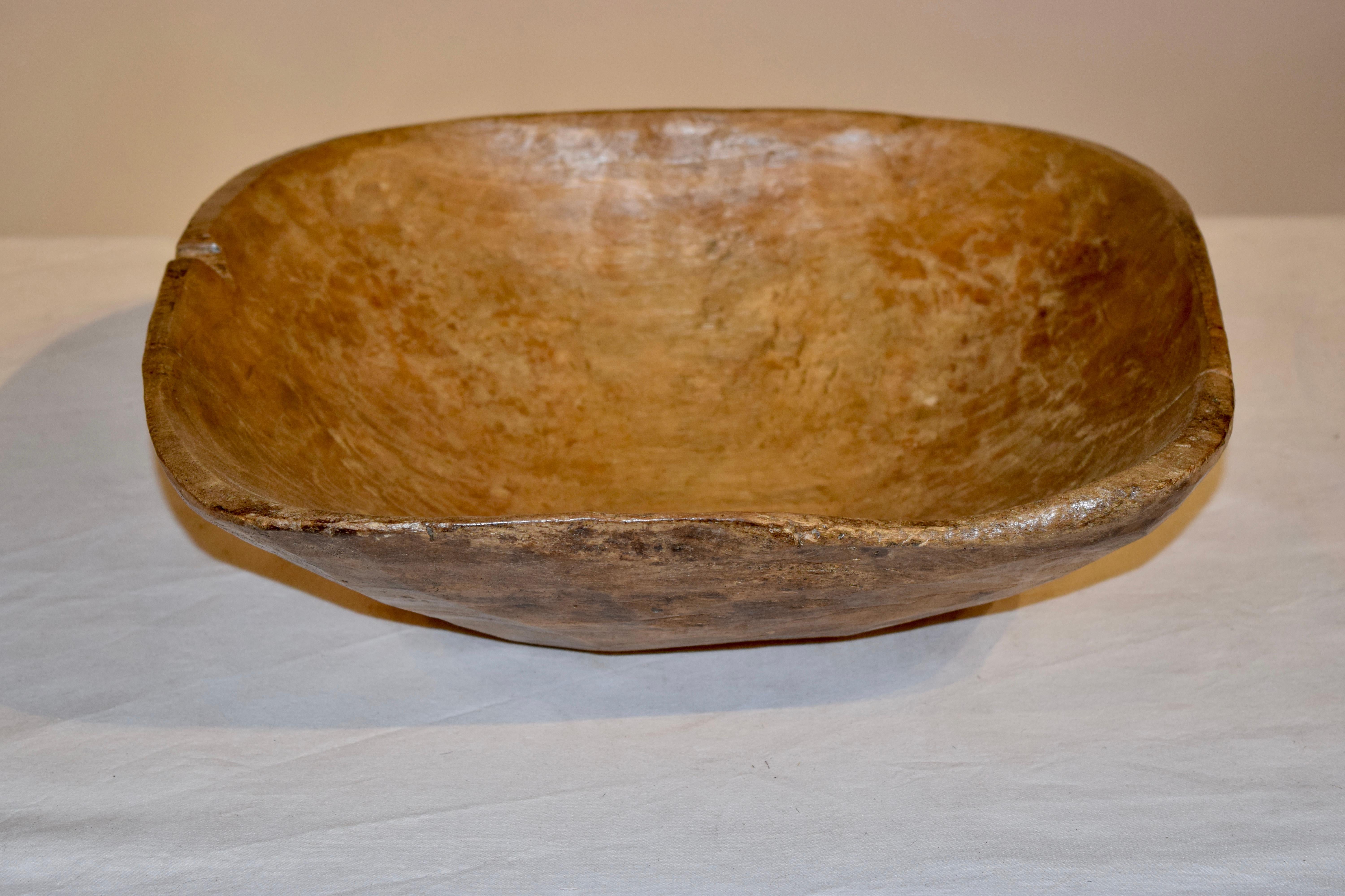 19th century dough bowl from England made from sycamore. Normal wear and shrinkage from age and use.