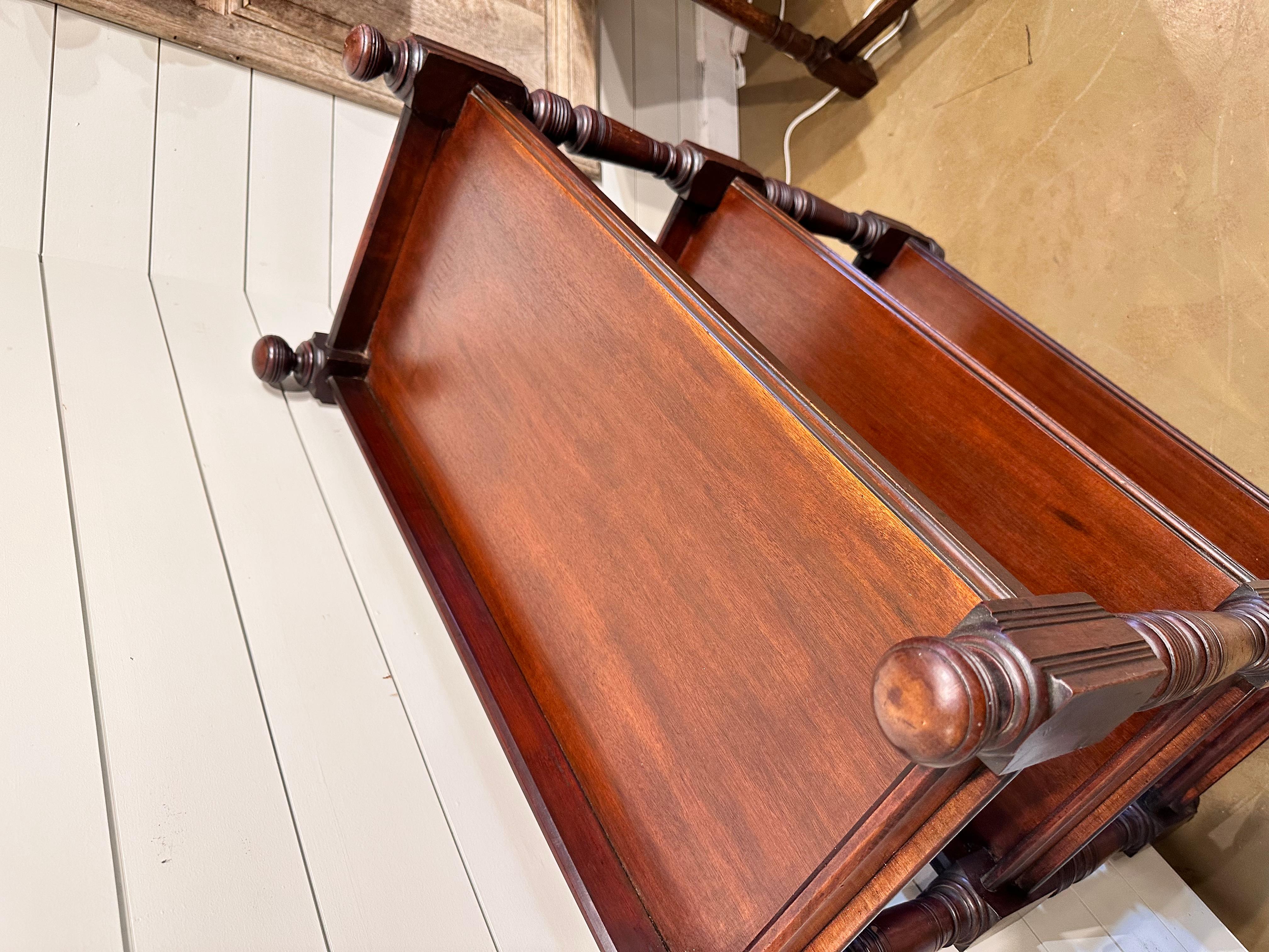 This is a beautiful 19th century English dumbwaiter! Three tier, wide shelves provide lots of room for storage! The wood is glossy and deep in color and character. Along with beautifully  turned legs.