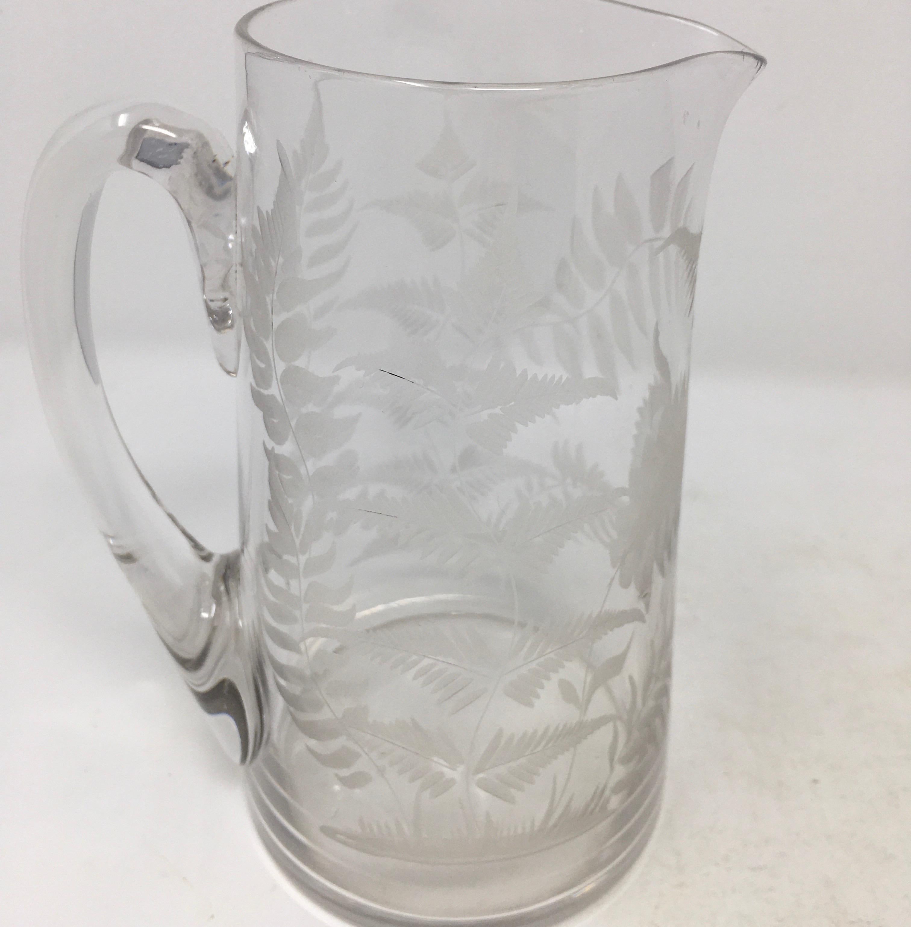 This is a beautiful English etched glass pitcher. The pitcher features intricate etched-glass work with ferns. A lovely piece for bedside or on the table.

This piece weighs 1.5 lbs.