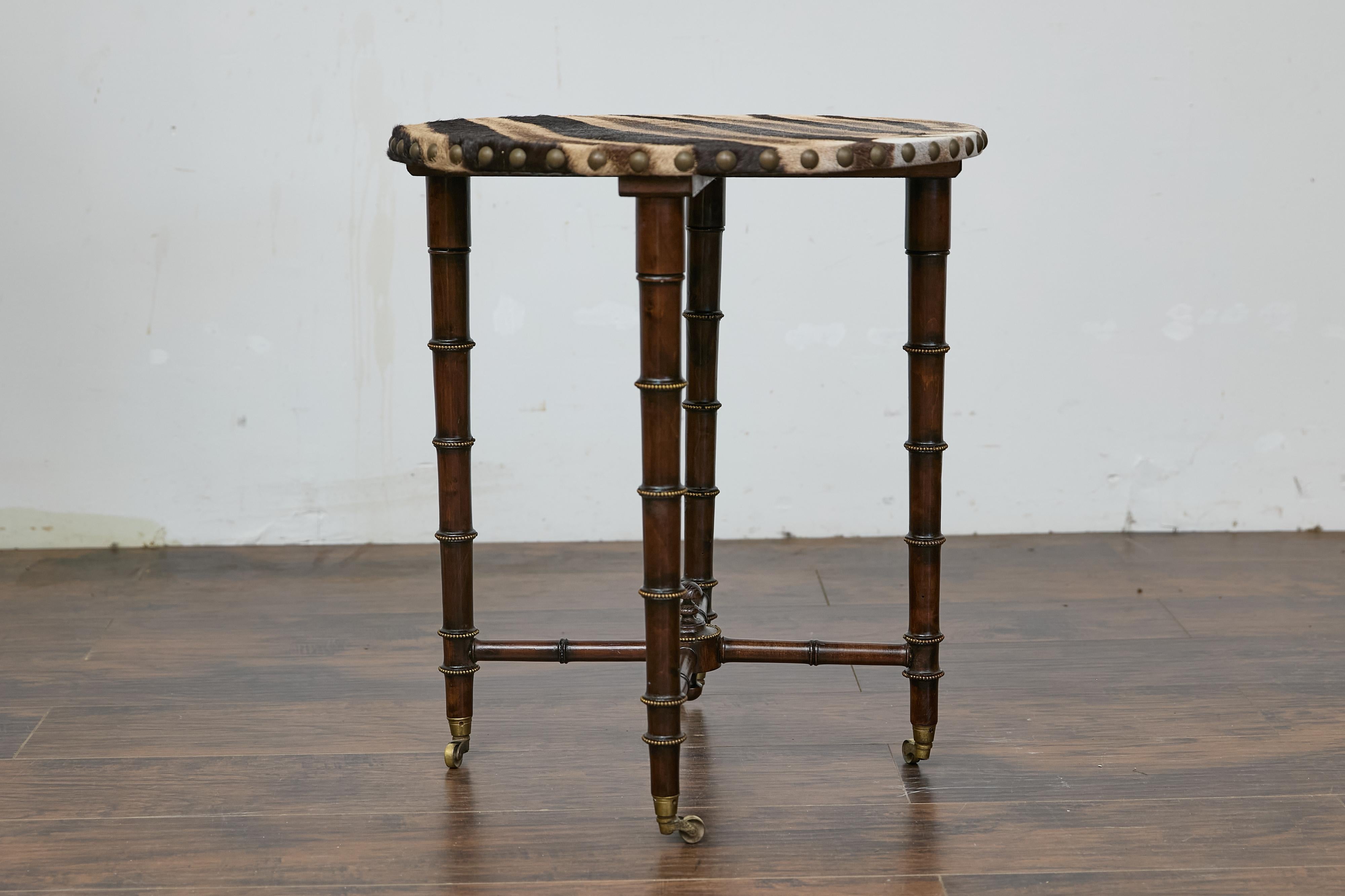 Turned 19th Century English Faux Bamboo Side Table with Zebra Hide Top and Casters For Sale