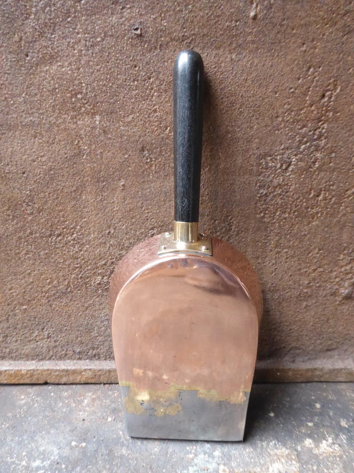 19th century English Georgian fireplace shovel made of polished steel, polished brass, polished copper and wood.