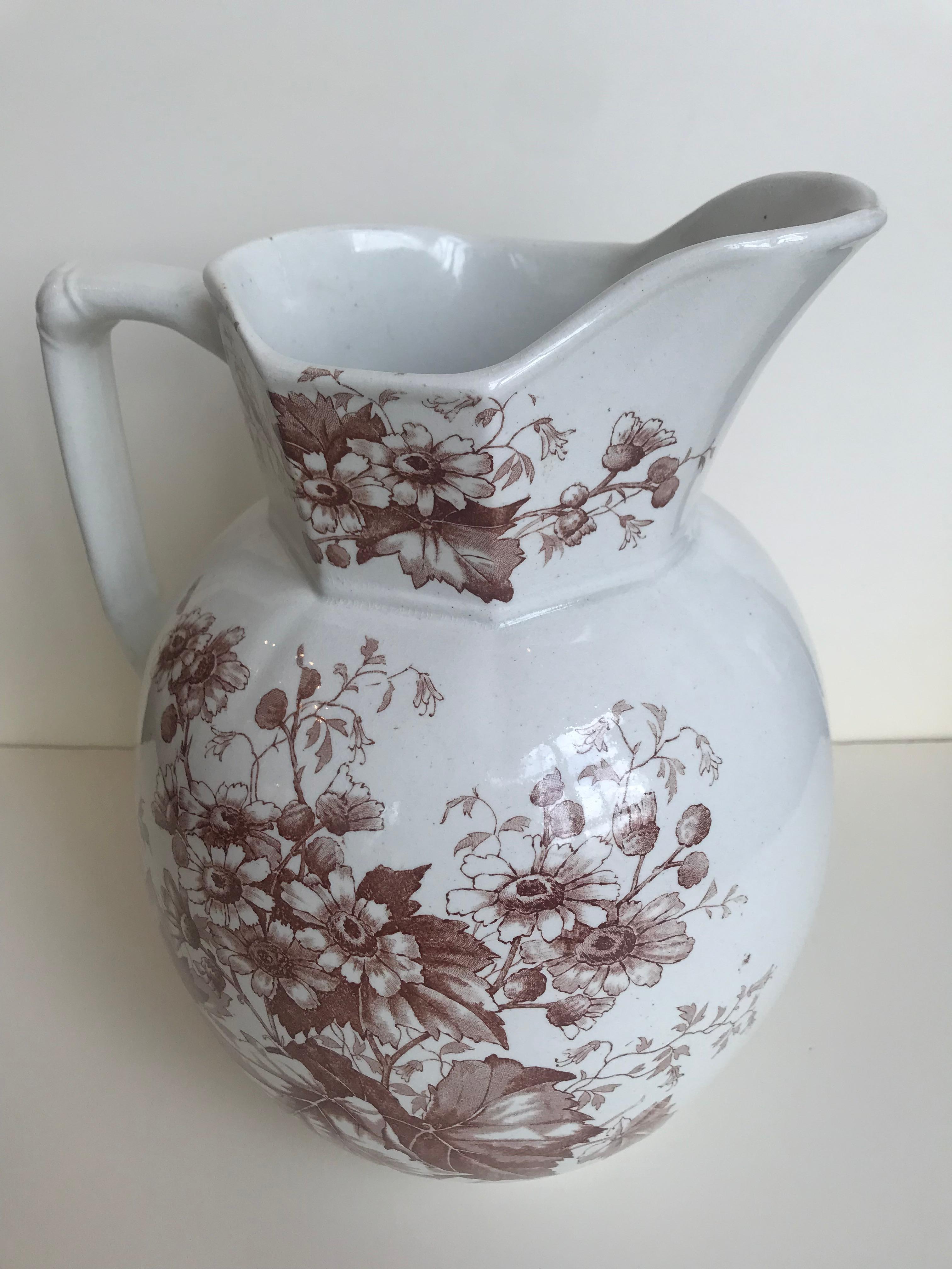 19th century English floral ironstone pitcher; squared handle.
Anchor, B, 146 marking on bottom.