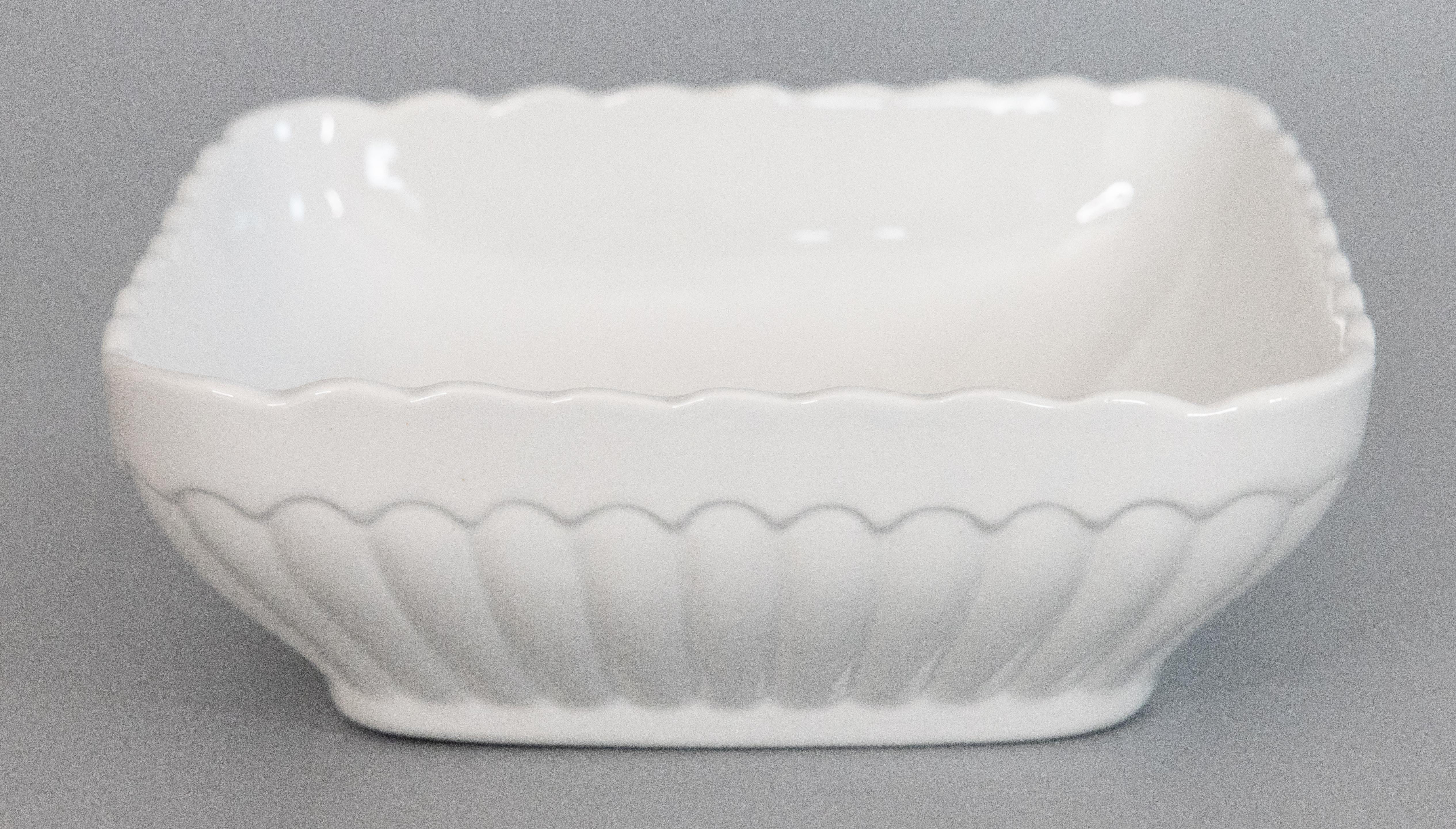 A beautiful antique English white ironstone bowl with a lovely fluted design, circa 1890. Maker's mark on reverse. This would be a wonderful addition to an ironstone collection and would look fabulous filled with fruit or other decorative objects.