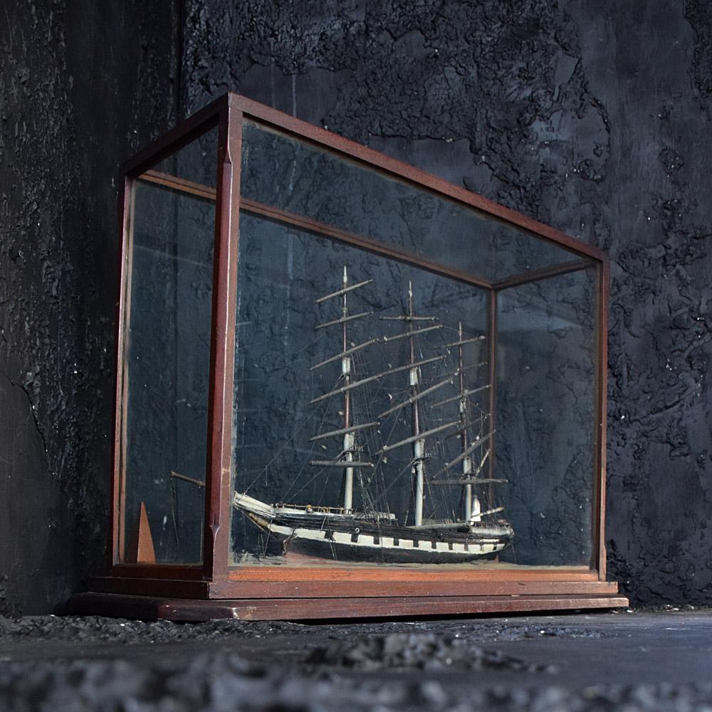 19th Century Folk Art Encased Ship Diorama    
A delightful and highly decorated example of a late 19th century English folk art ships model diorama. Encased in a well-crafted glass and wood removable display case. 
Size in inches: H 21” x W 12” x D