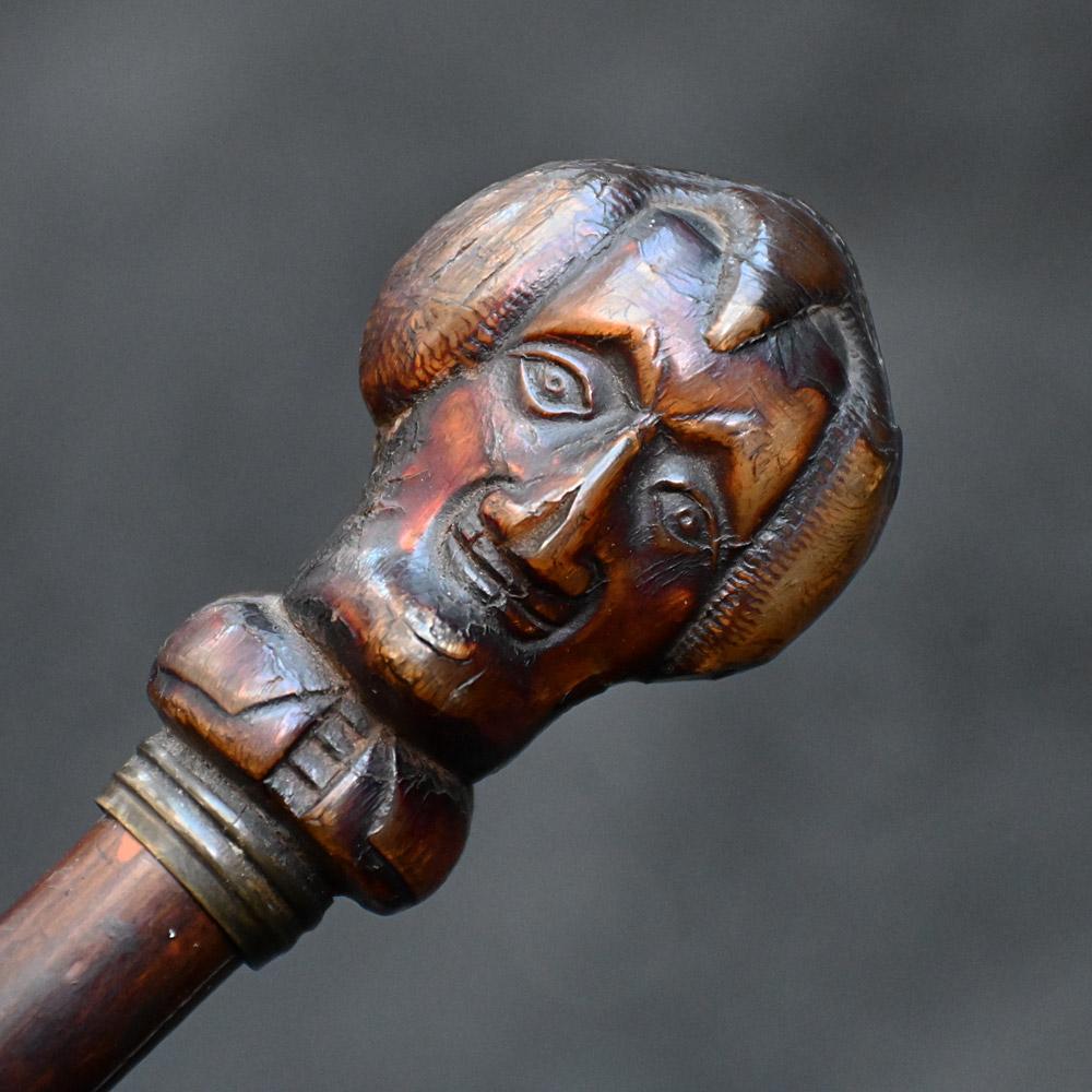 19th Century English Folk Art Gentleman’s Cane  

A rare and quite special example of a 19th Century folk art English gentleman’s walking cane with a hidden surprise. Made from a single piece of ebonised cane, with metal tip. The shaft is quite