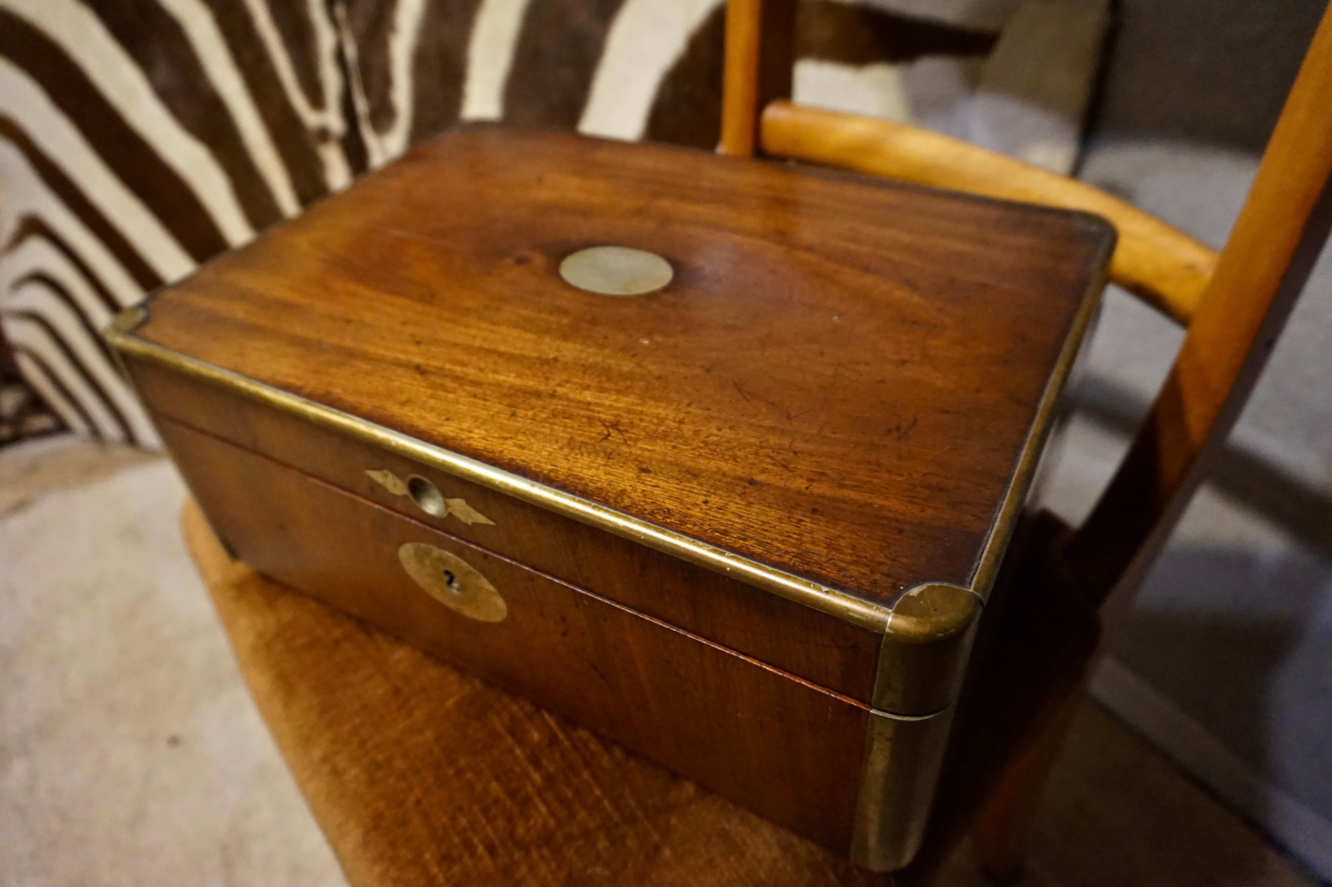 High quality English mahogany and brass fine jewelry box that was likely used for stationary as well. Attention to detail, originality and surviving key,

circa 1870s.