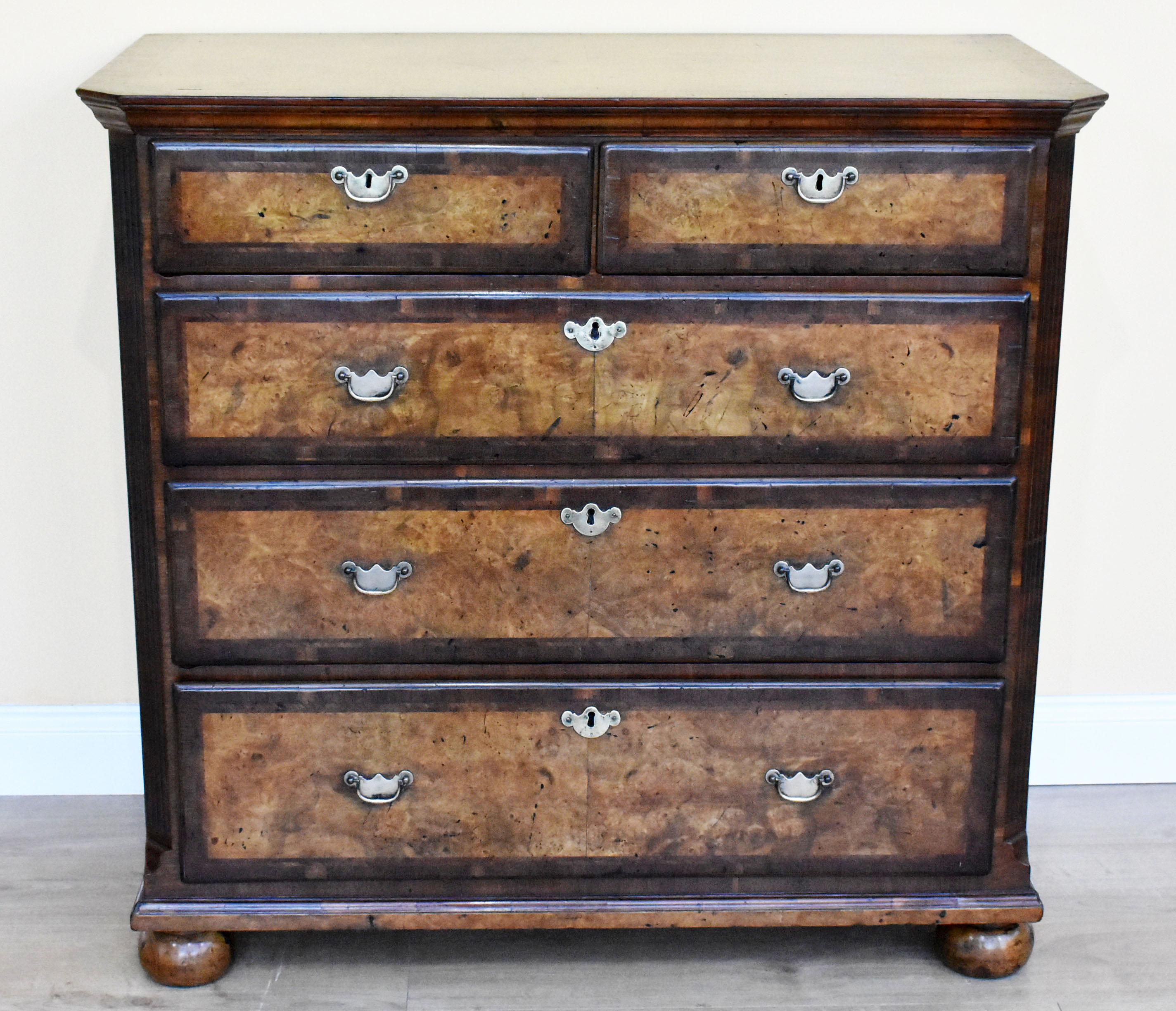 For sale is a good quality George III burr walnut chest of drawers. The top of the chest has walnut banding as well as herringbone inlay. Below this the chest has two short drawers, over three graduated drawers, each with walnut banding and