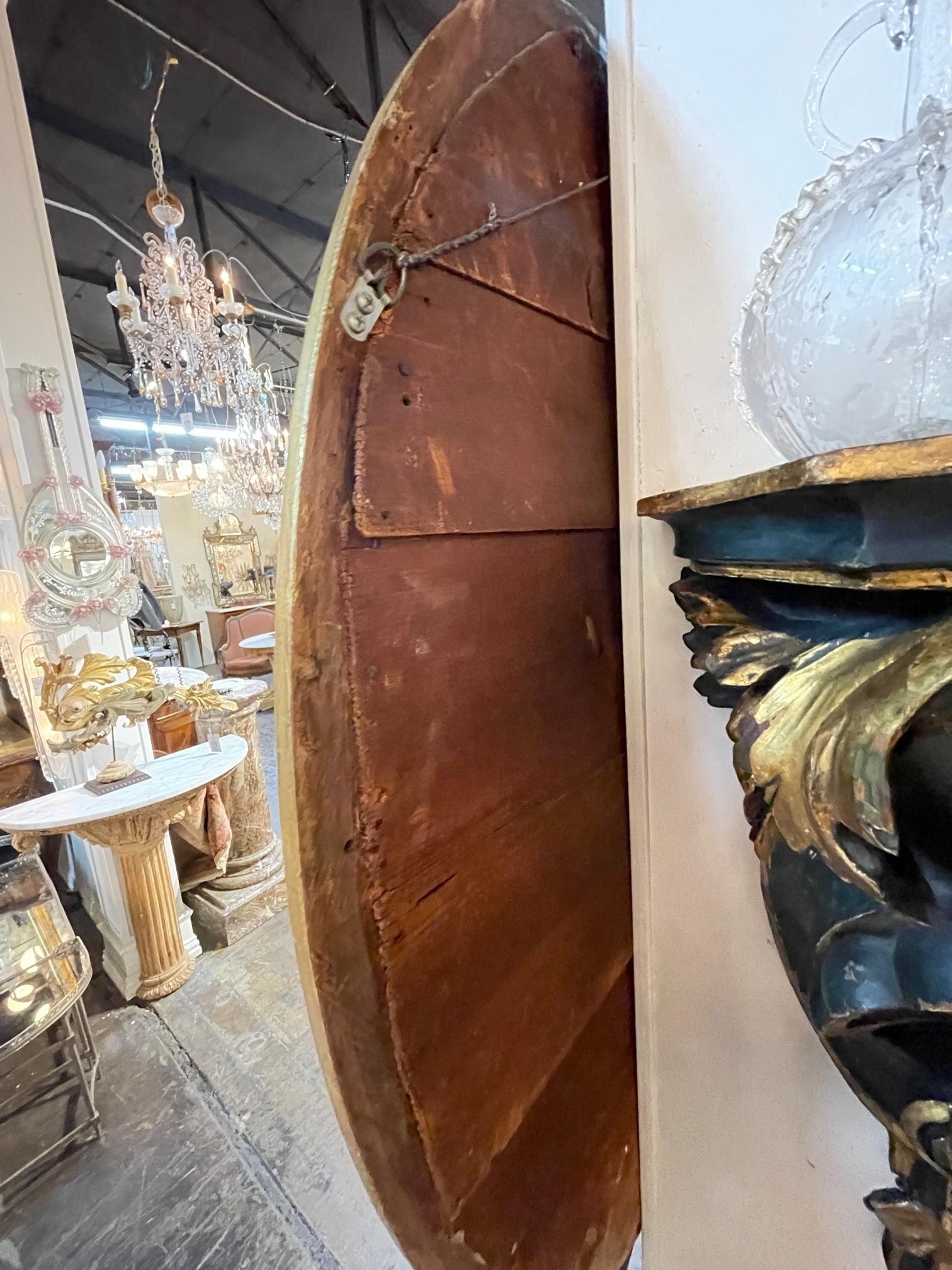Miroir ovale anglais du 19ème siècle en bois sculpté et doré George III en vente 4