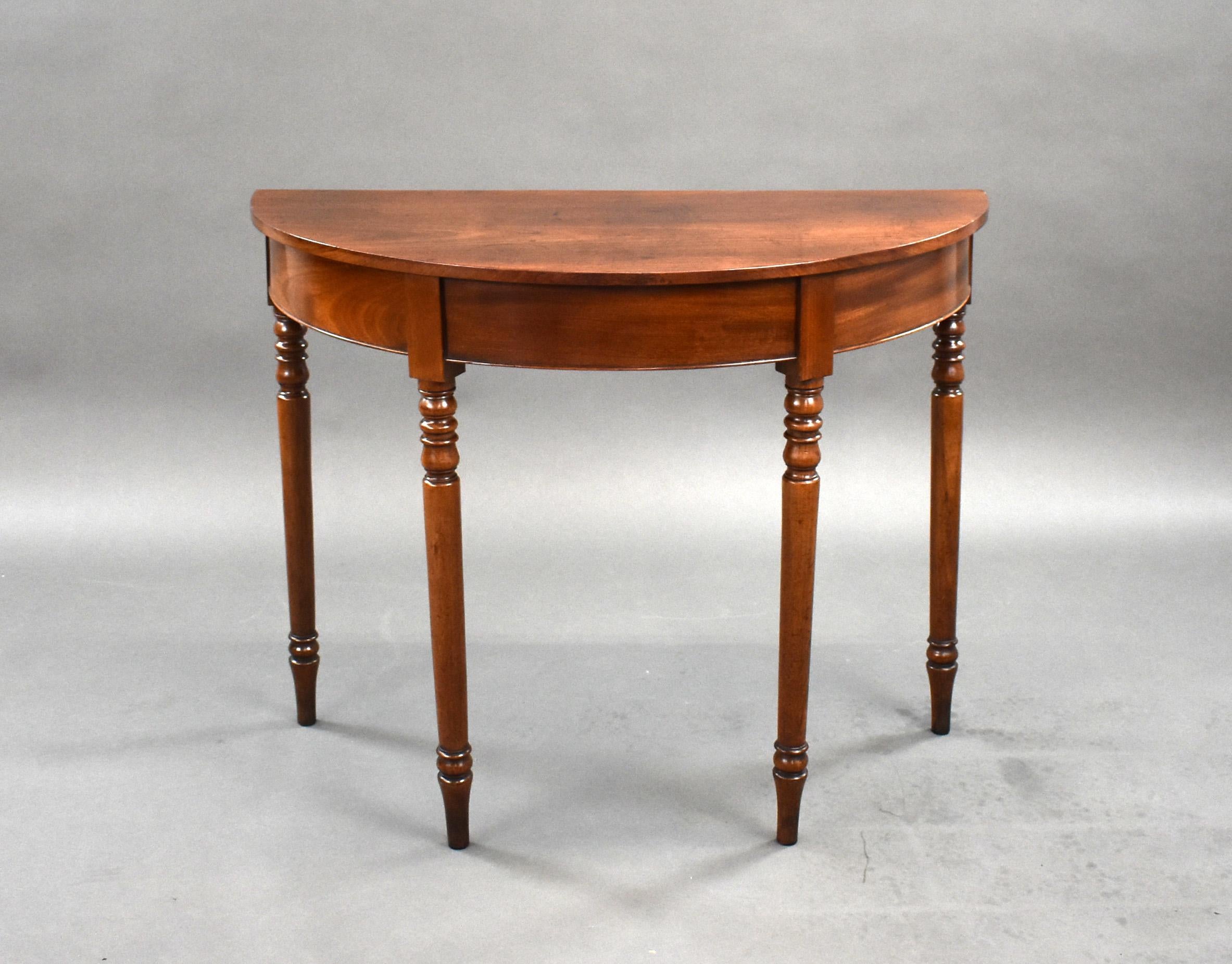 For sale is a good quality George III mahogany demi lune console table, having a well figured top, standing on elegant turned legs, this table remains in very good condition for its age. 

Measures: width: 97cm depth: 48cm height: 76cm.