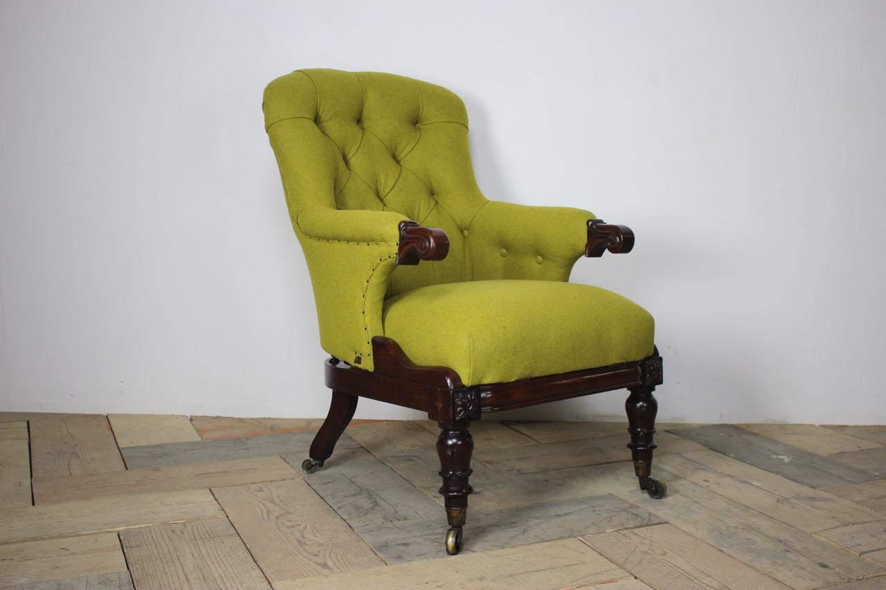 A fine quality 19th century English, George IV easy reclining library armchair. The shaped back, combined arms and mechanical reclining seat, having been reupholstered by us in green wool on a mahogany frame base with registration mark. Curved and