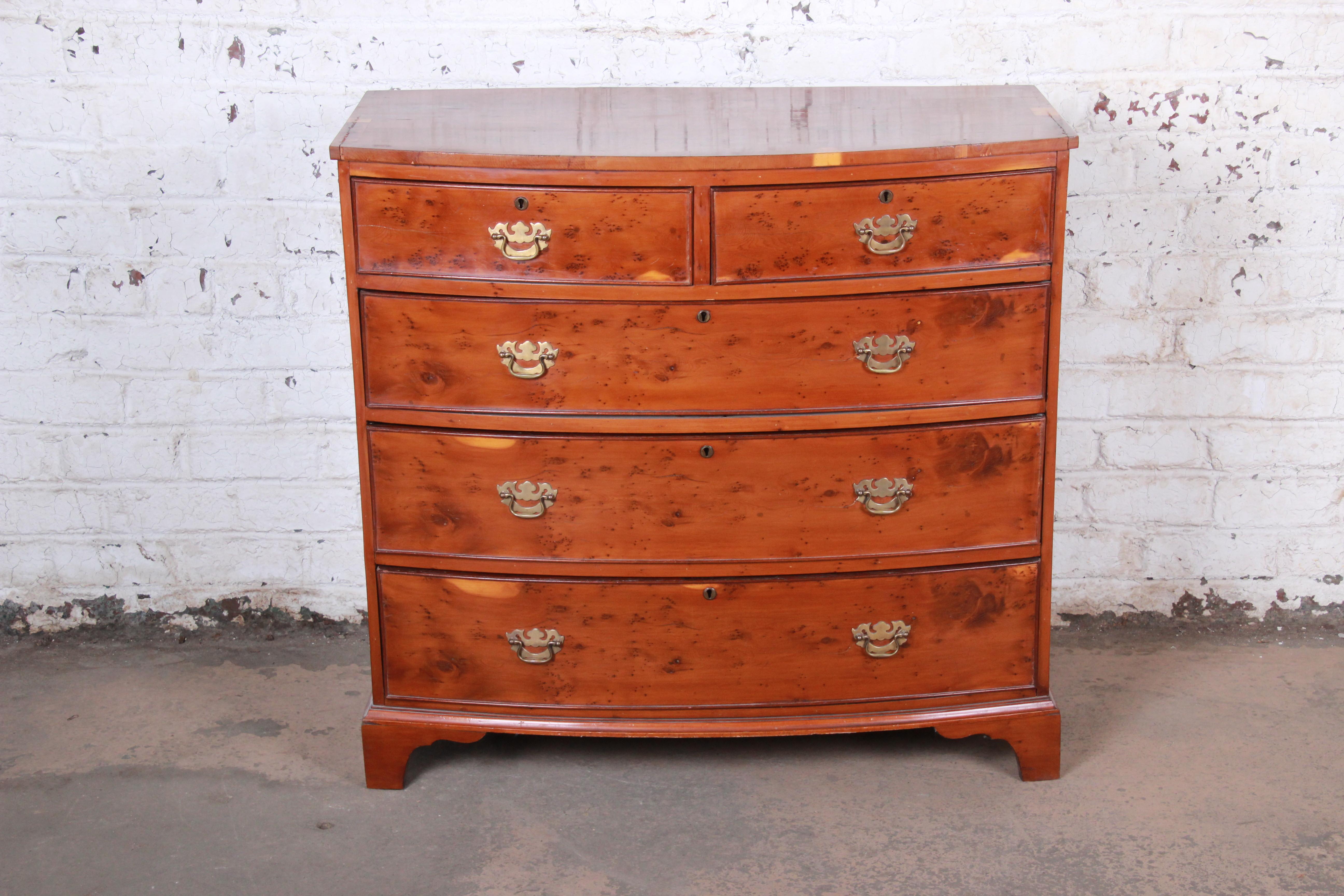 A gorgeous antique Georgian bow front yew wood five-drawer dresser chest

England, circa 1850

Yew wood and brass hardware

Measures: 41.38