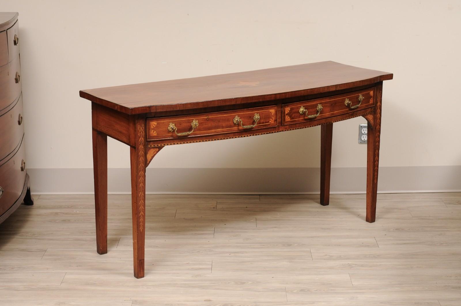 19th Century English Georgian Bowfront Mahogany with Inlay Console Table

Detailed with Ribbon Inlay running down the front legs and beautiful Urn on the Top.

