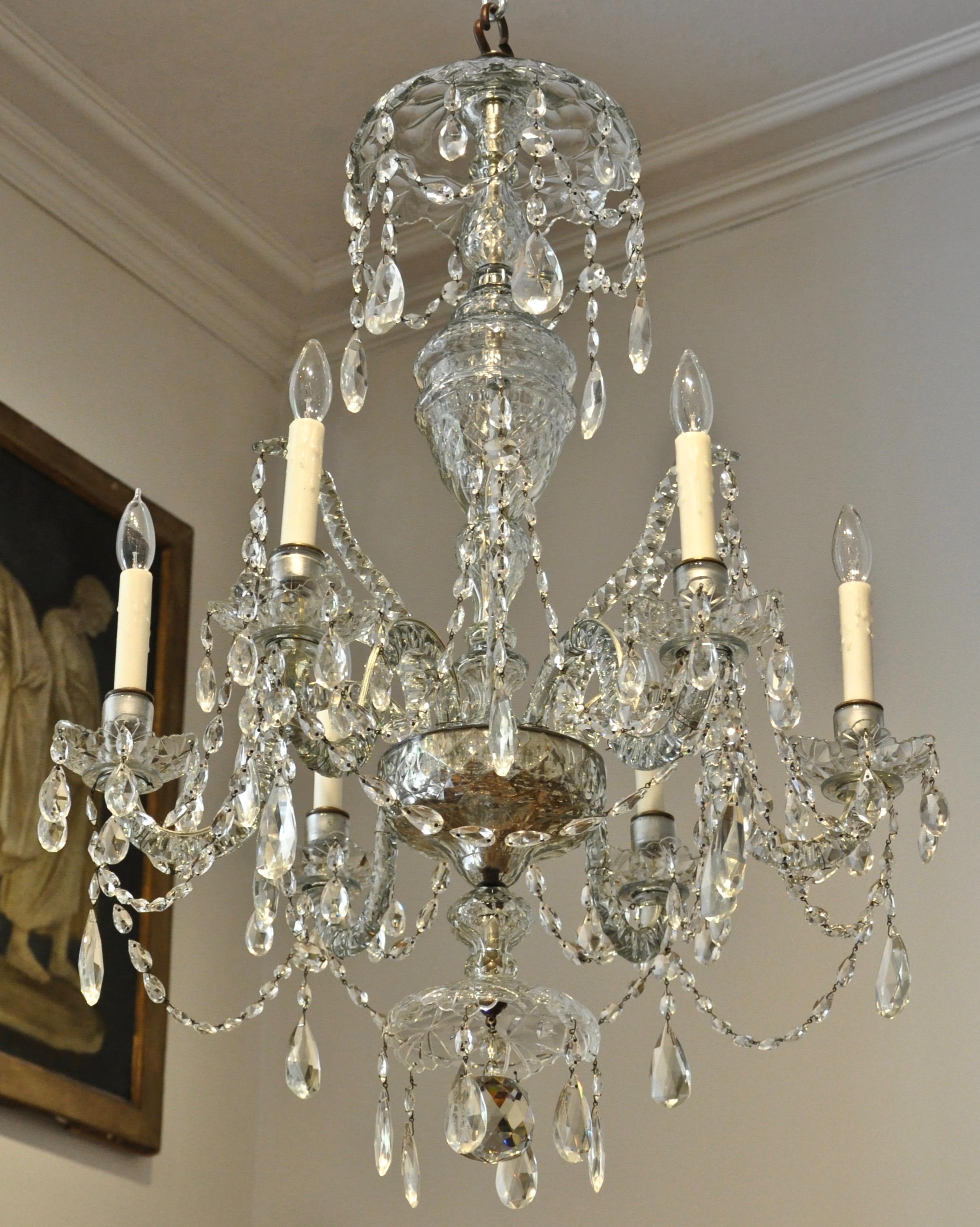19th century English crystal chandelier of Georgian neoclassical style

--Six-arm French wired handcut crystal chandelier with swan neck upward arms and original cut crystal bobeches.
--Original throughout and in excellent condition 
--Georgian