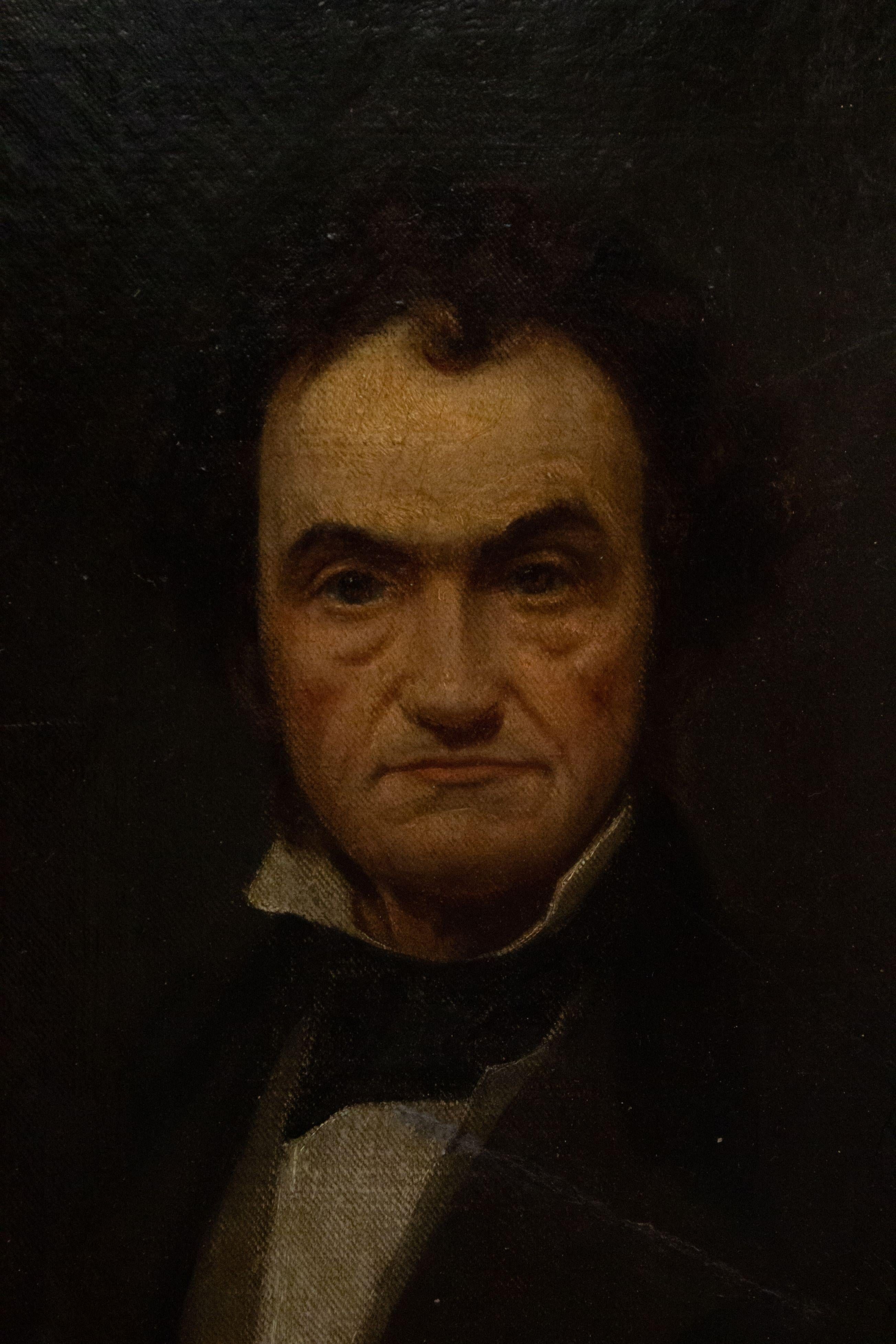 Portrait à l'huile encadré et doré de style géorgien anglais, peinture d'un homme du 19ème siècle assis sur un coussin rouge.