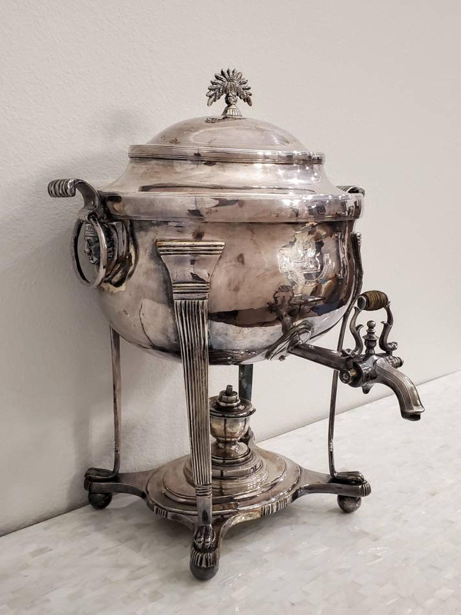 A fine quality antique English silver-plated samovar, exceptionally executed, the lidded urn features engraved large armorial royal crest with a large lion rampant and motto that reads: 
