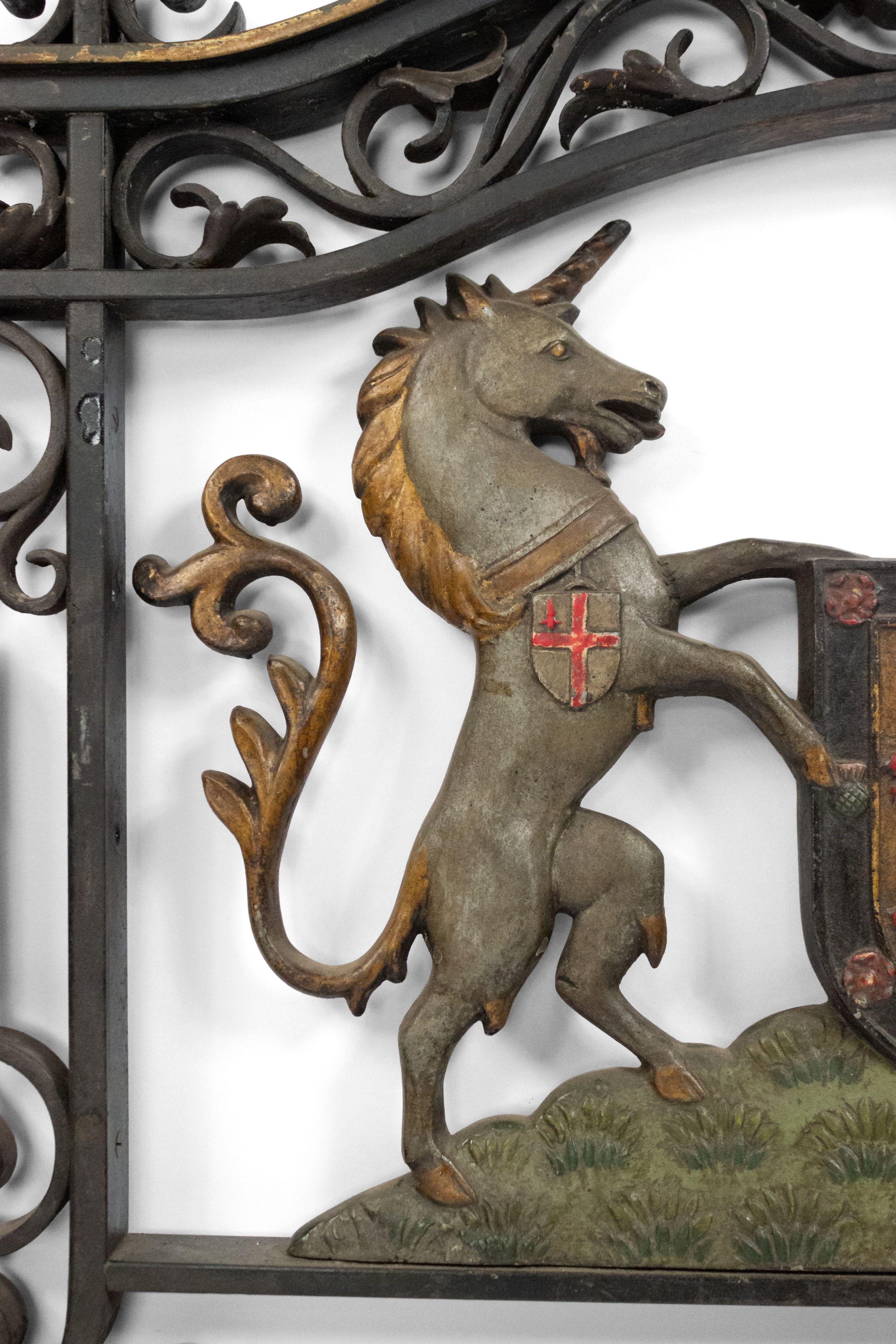 English Georgian style (19th century) iron wall plaque of coat of arms with 2 unicorns in filigree scroll frame.