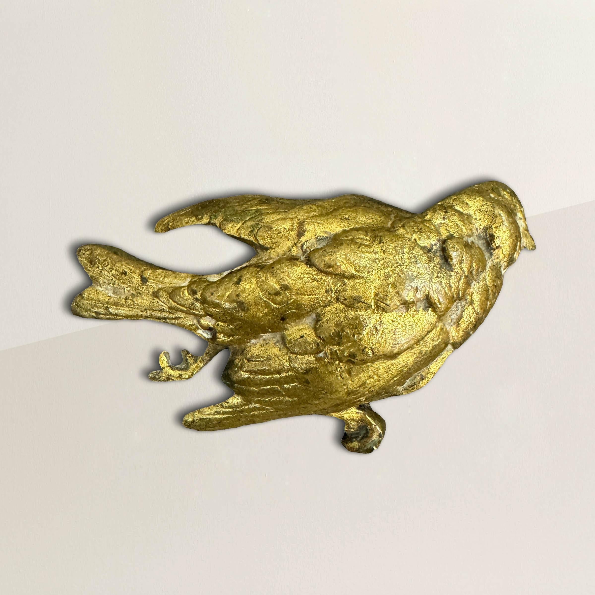 This 19th-century English life-size gilt bronze sculpture delicately captures the poignant beauty of a dead finch, meticulously crafted with intricate detail. In Victorian England, dead birds symbolized mortality, urging contemplation of life's