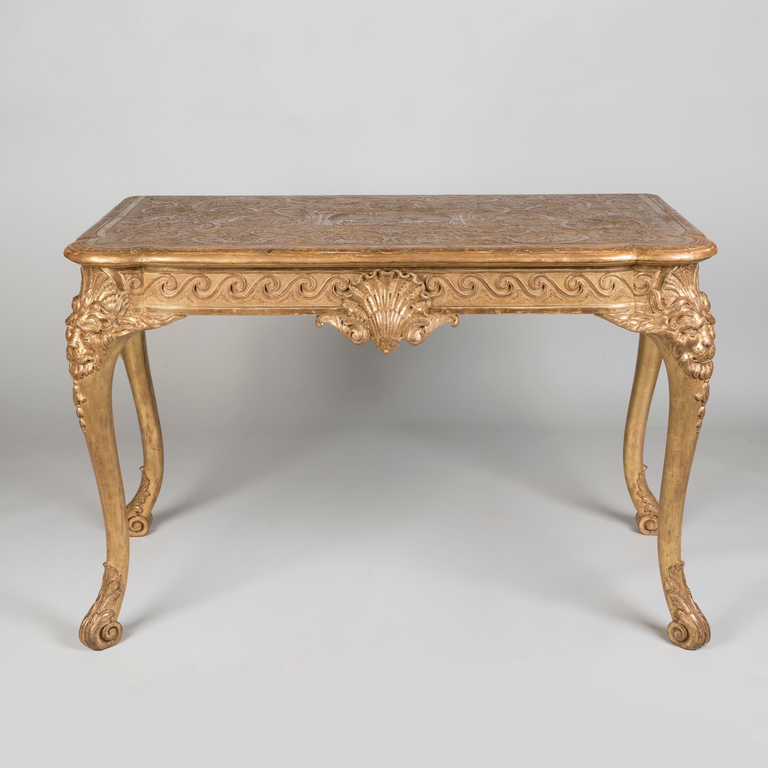 A Handsome Gilt console table of Early Georgian Style

The whole, gilt: the shaped and lobed cornered top of carved gesso having in the centre the figures of Diana and a stag in a cartouche: the stag and deer motif repeating among the copious
