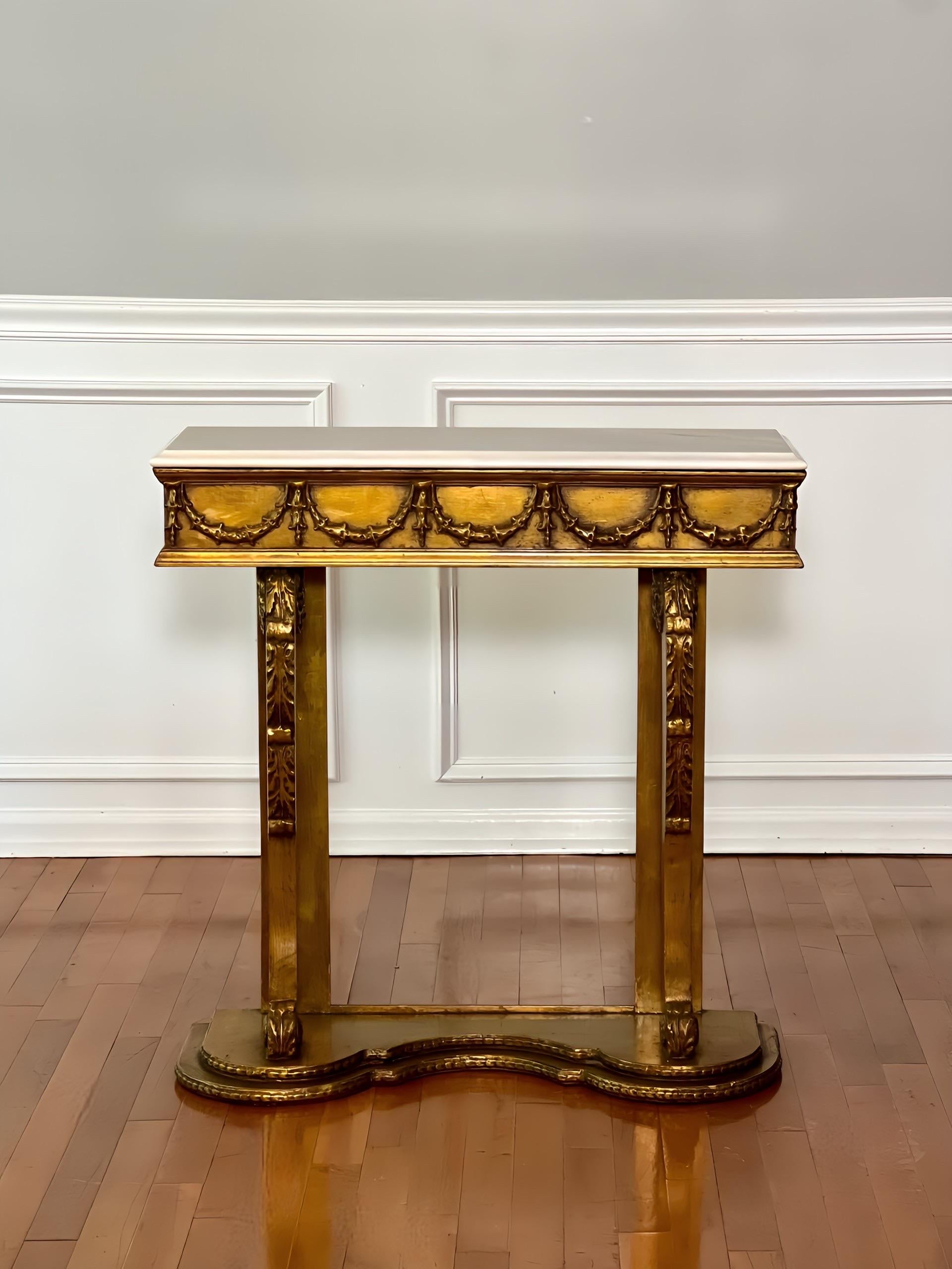 Exceptional antique English giltwood and marble top narrow console table, ca. 1880. A rectangular, white beveled marble top rests on a swag wrapped frieze, supported on curved front supports with foliate vines and rosette medallions ending in scroll