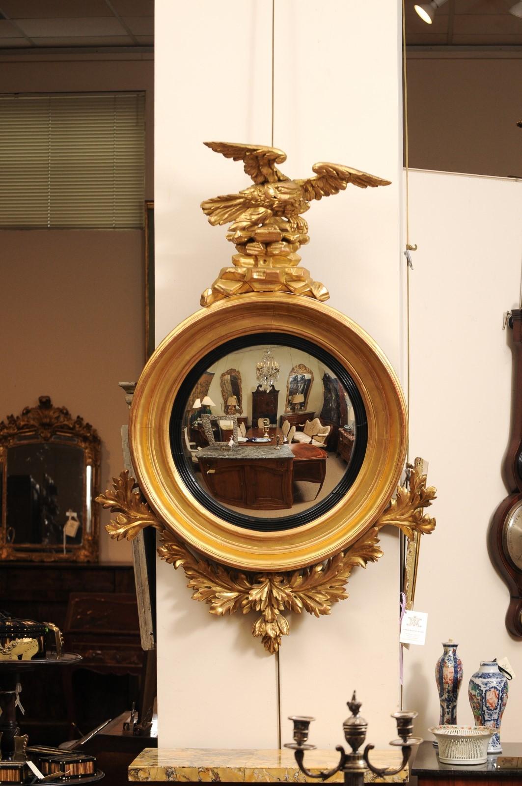 
19th Century English Giltwood Bull’s Eye Mirror with Eagle Crest & Convex Mirror