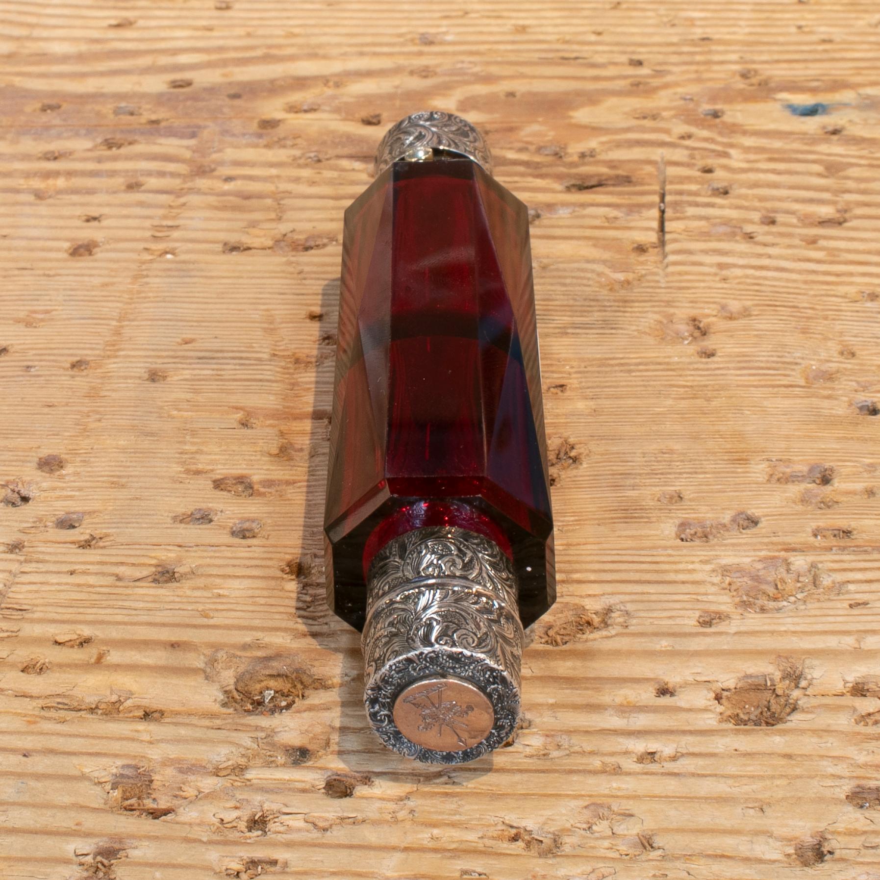 19th century English glass and silver perfume bottle with crown and inscription.