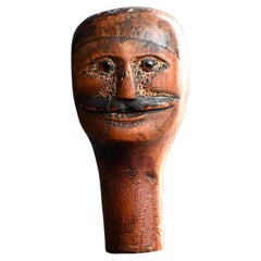 Cabeza de marioneta inglesa del siglo XIX con ojos de cristal