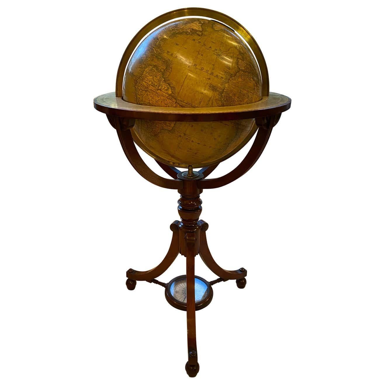 An extremely rare and important 21 inch English globe by renowned cartographers John Newton and Son, one of the most important globe makers of early 19th century England. Representing the terrestrial landscapes, this sphere rests in its gorgeous