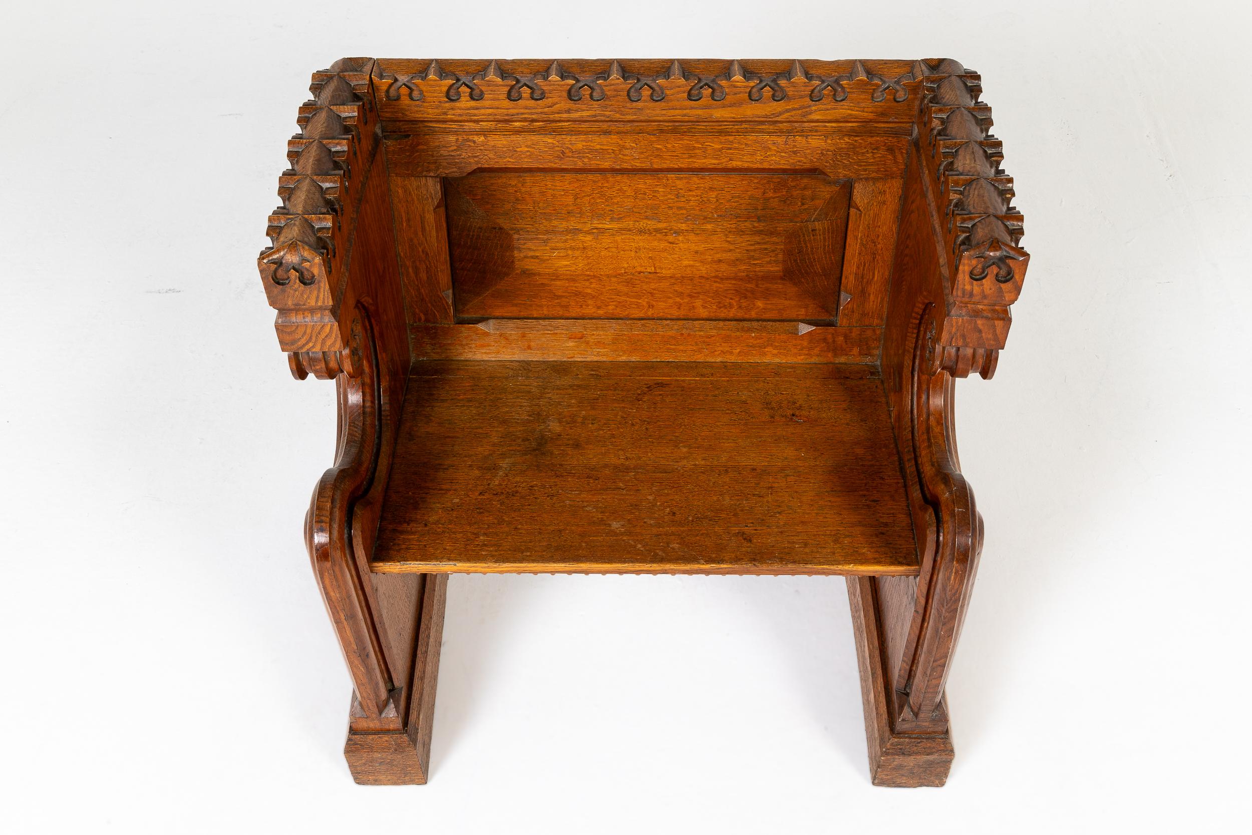 An Unusual 19th Century English Gothic Revival Oak Hall Seat or Small Bench.

This unusual bench is clearly related to the ecclesiastical furniture designed by the likes of A. W. N. Pugin in the mid to late 19th century and is, in essence, a smaller