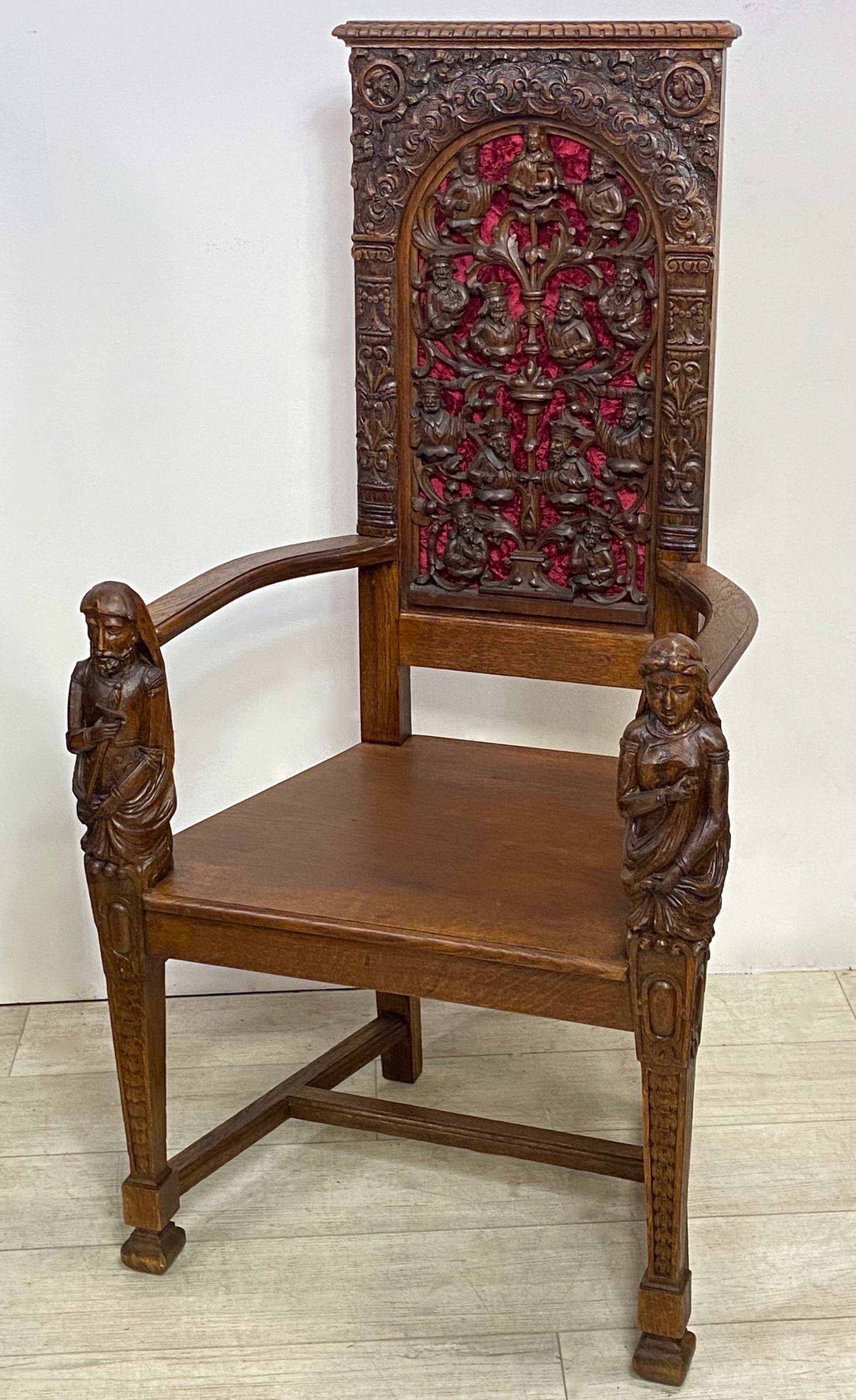 A mid to late 19th century hand carved oak armchair, having an elaborately carved back panel with antique burgundy velvet back lining.
Recently re-stored. In beautiful condition. Sturdy and very solid.
Old well executed repair to one arm rest.
  