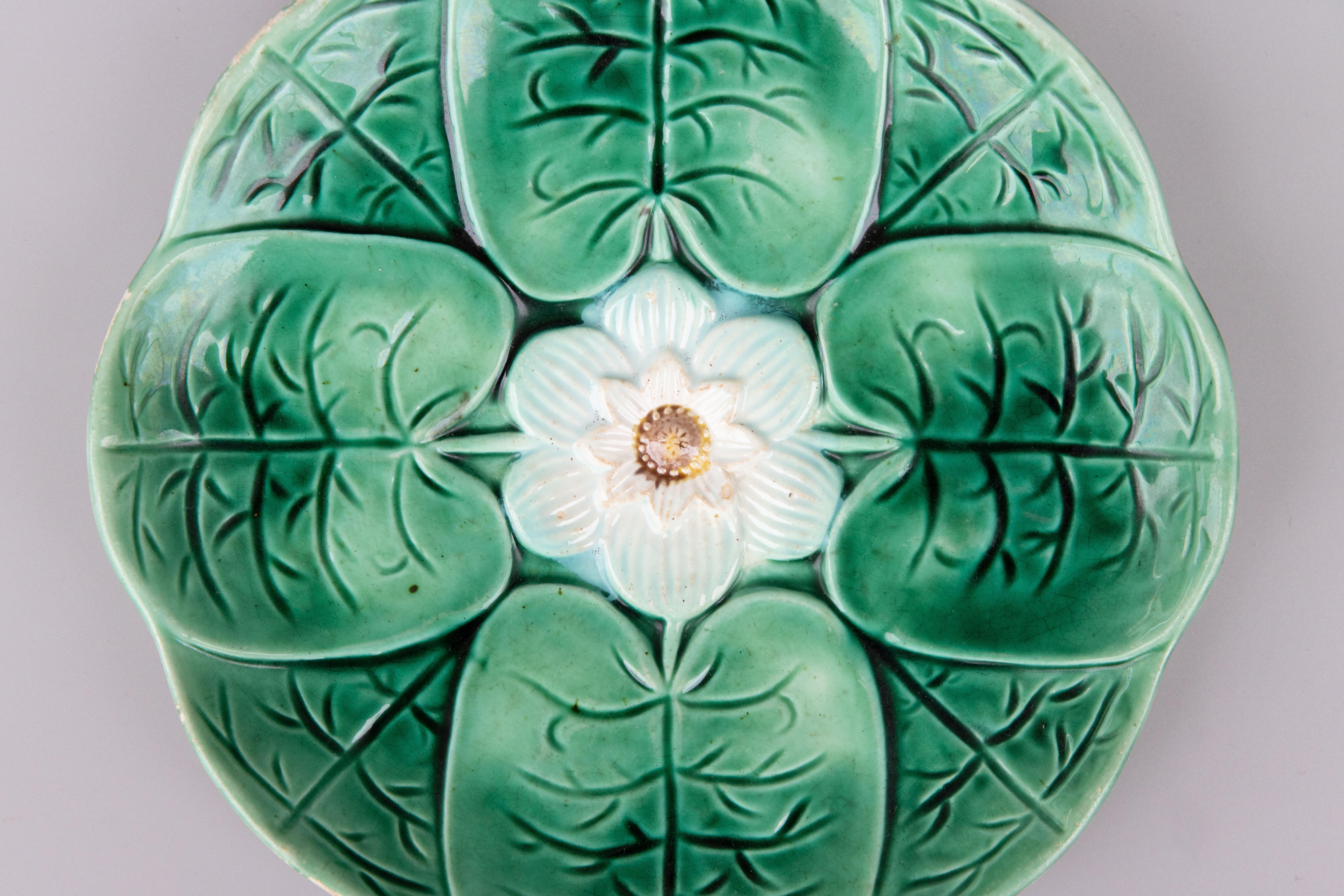 A lovely antique English green glazed majolica water lily lotus plate attributed to Joseph Holdcroft, circa 1870. It displays beautifully and would be wonderful hung on a wall or placed in a cabinet or added to a collection.

Dimensions
9.25