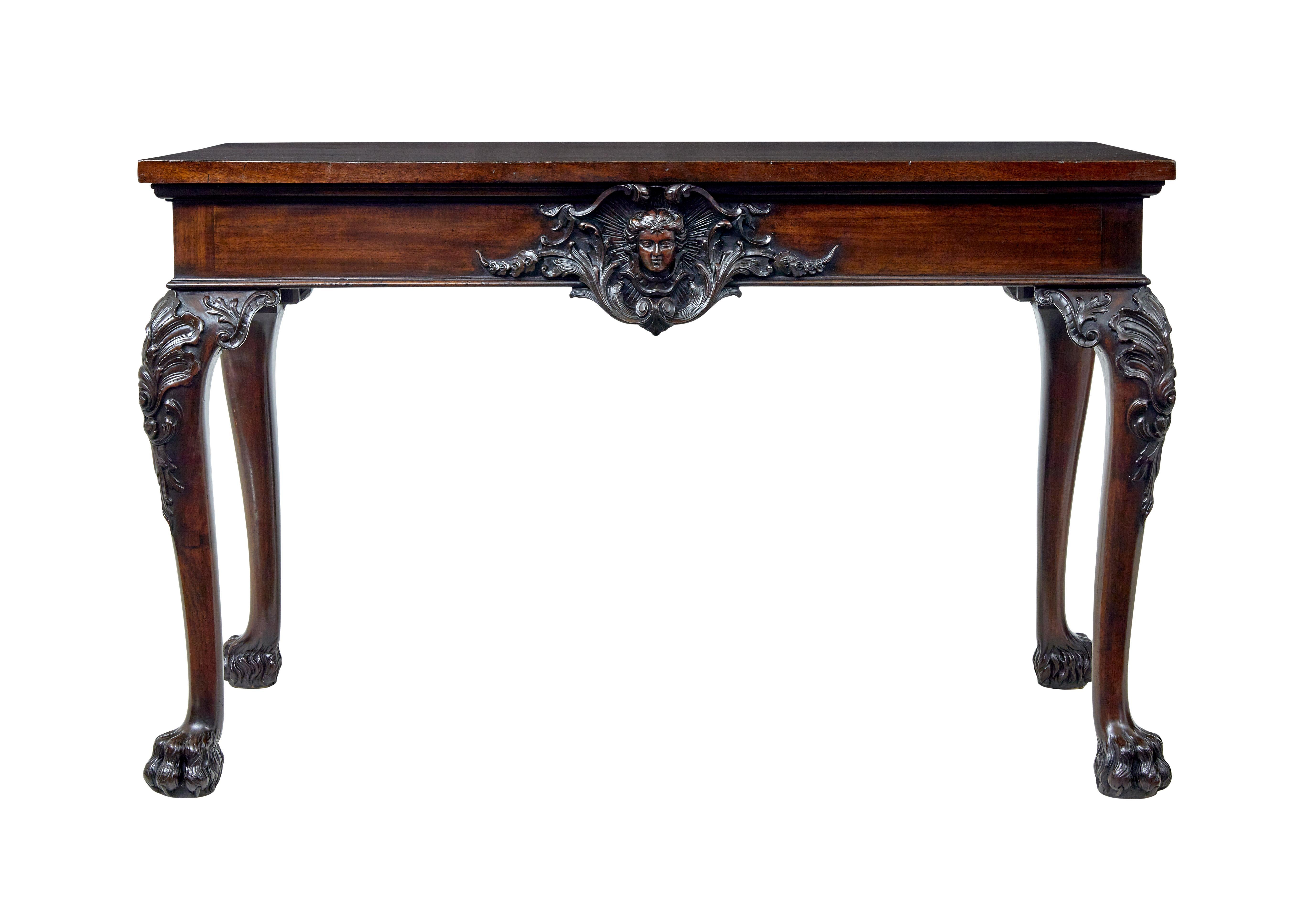 19th century profusely carved serving table circa 1880.

We are pleased to offer this stunning serving/side table beautifully carved in solid mahogany.

1 solid piece rectangular top, slightly over-sails the deep frieze which forms the backdrop for