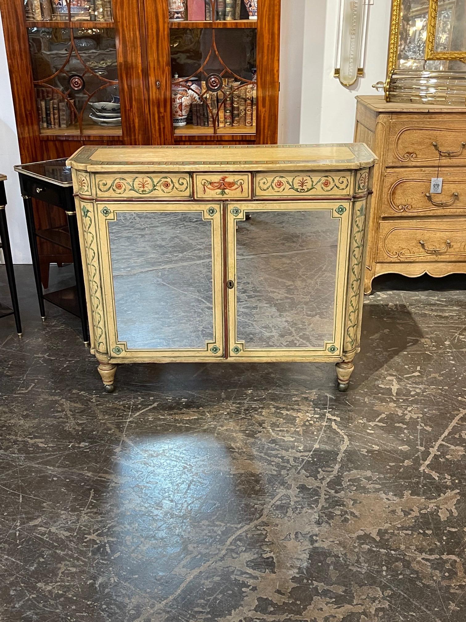 Pretty 19th century English hand painted narrow cabinet with inset mirrored doors. Nice painted designs including Greek key and floral images. A beautiful unique piece!