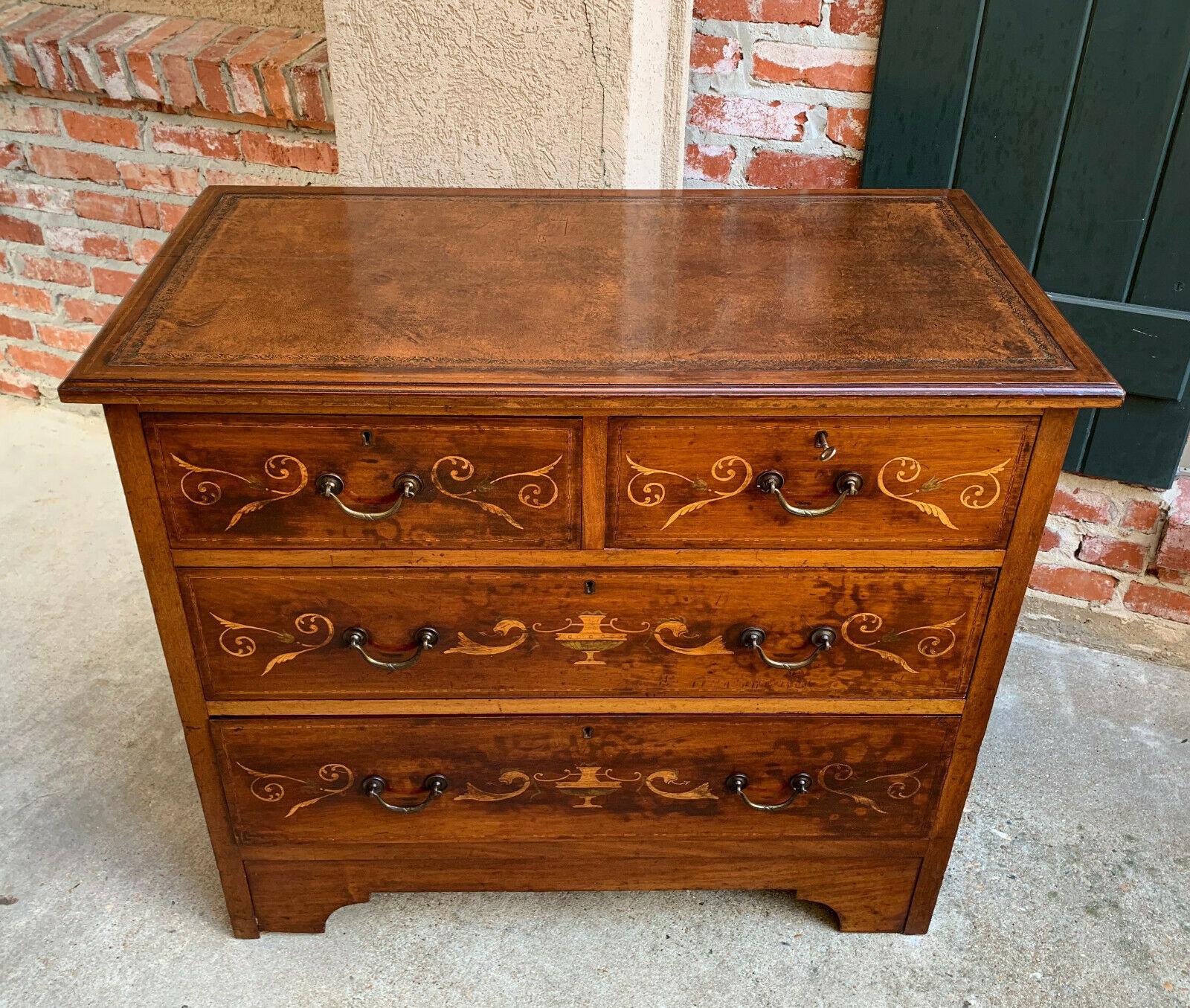 ~Direct from England~
~Lovely and versatile antique English inlaid chest of drawers WITH EMBOSSED LEATHER TOP!~
~FOUR DRAWERS, two smaller over two large drawers~
~Original hand painted designs on each drawer front~
~Original drawer