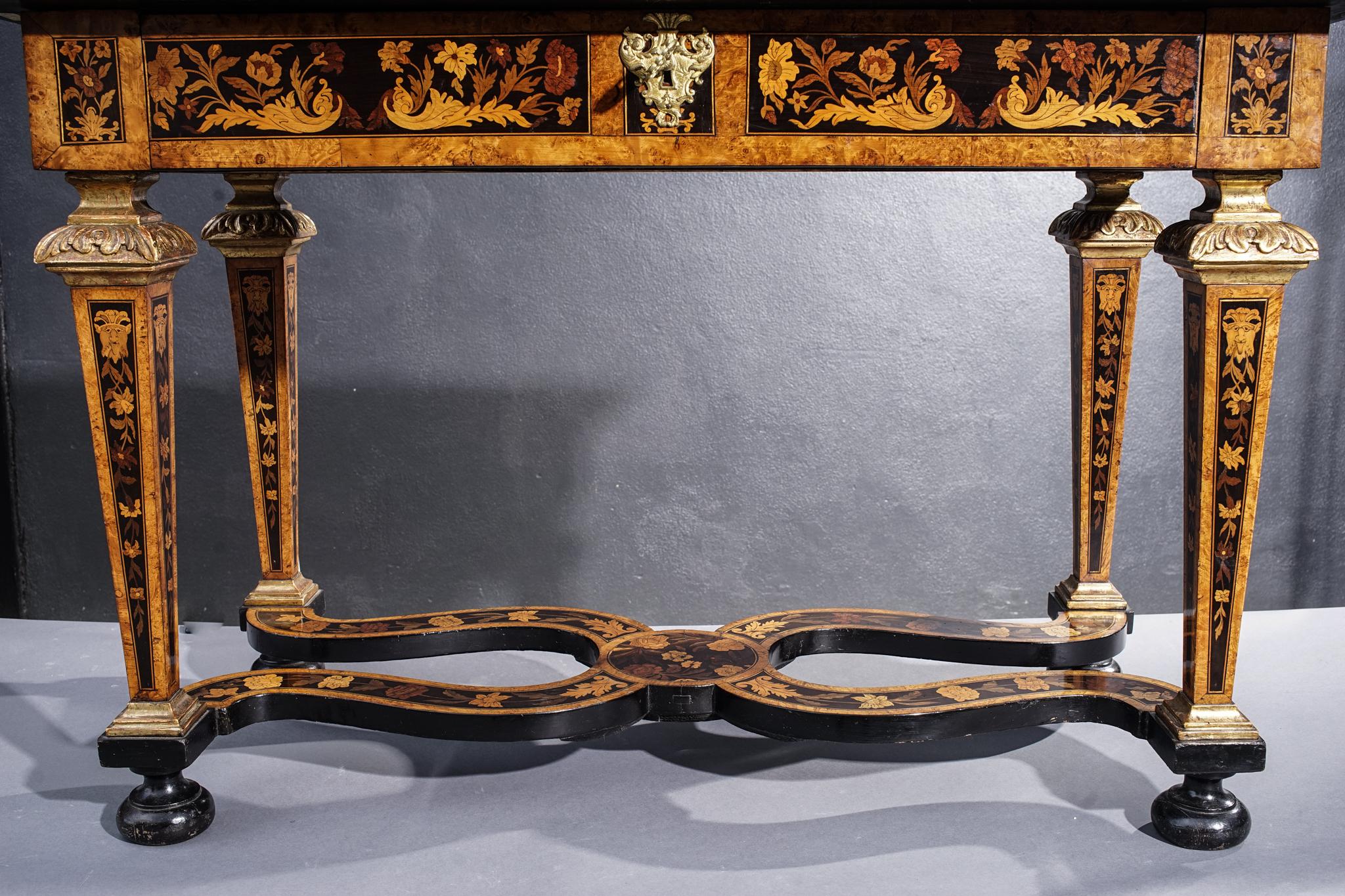 19th century English inlaid table with single drawer. In excellent condition for its age with carved giltwood details.