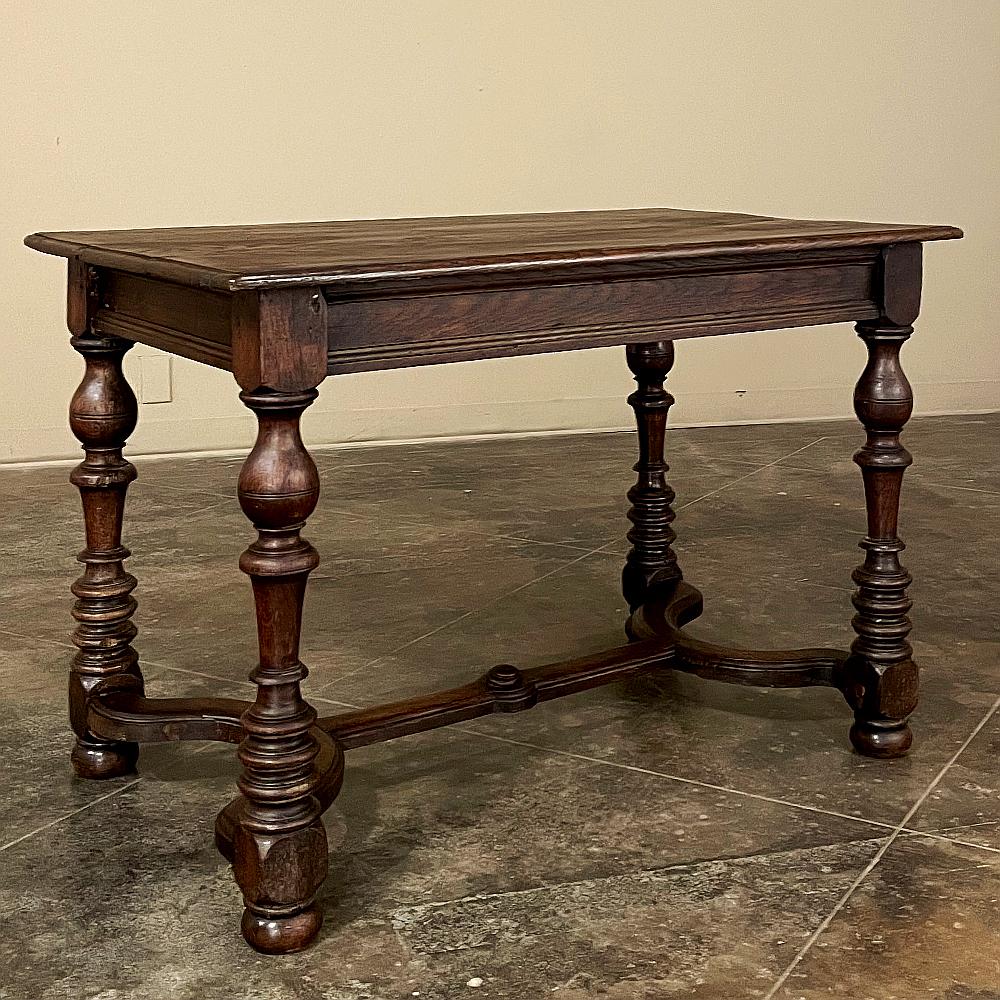 19th Century English Jacobean End Table was hand-crafted by able artisans from indigenous old-growth oak, and features a solid plank top supported by solid plank aprons connected on each corner with the top of four beautifully turned legs.  It would