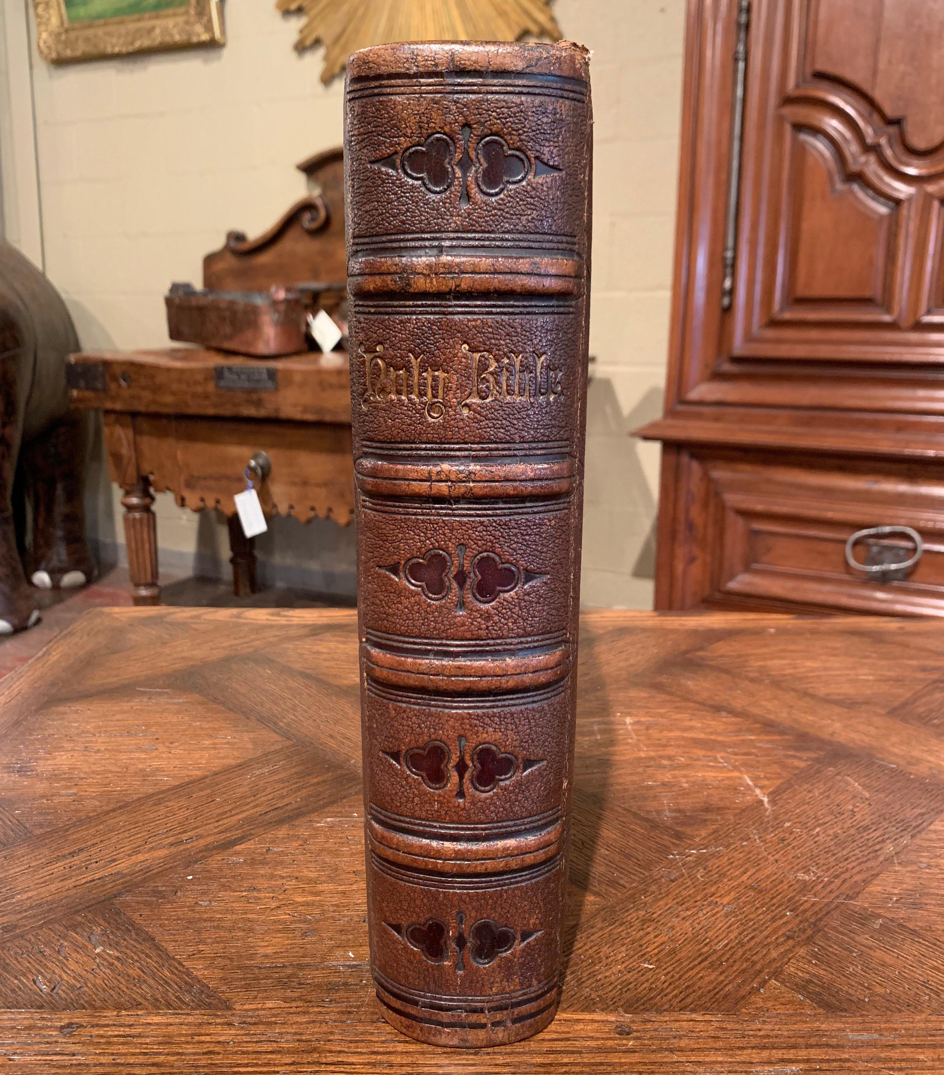 This beautiful antique Bible appointed to be read in churches, was printed at the University Press, Oxford, London and dated 1866. The book flaunts an engraved brown leather and is embellished with gilt edge pages. Inside, the Bible features the old