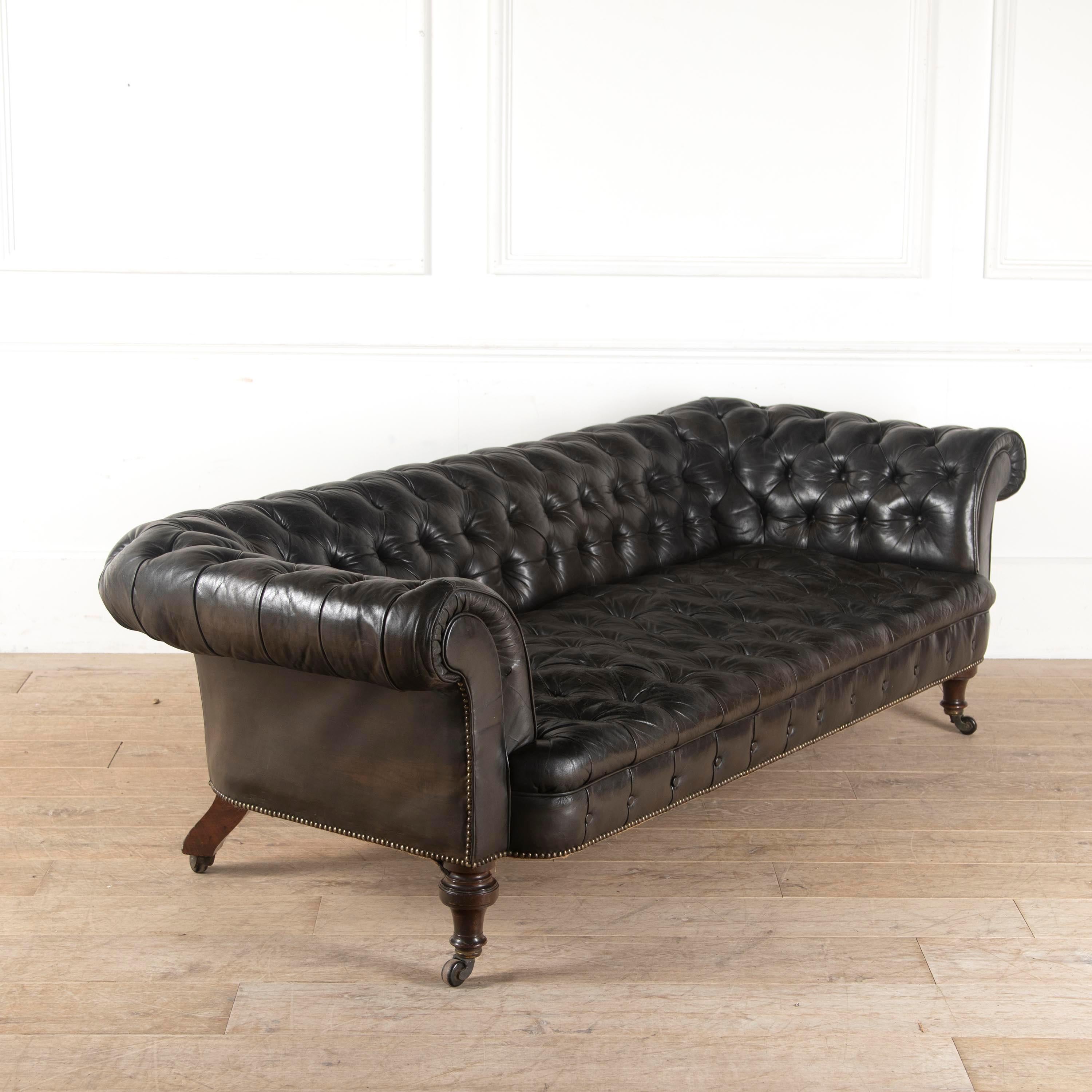 Beautifully proportioned mid-19th century English Chesterfield sofa.

It has been recently recovered in a wonderfully buttery black hide on boldly turned mahogany front legs.

Many of the innovations to this iconic model came circa 19th century,