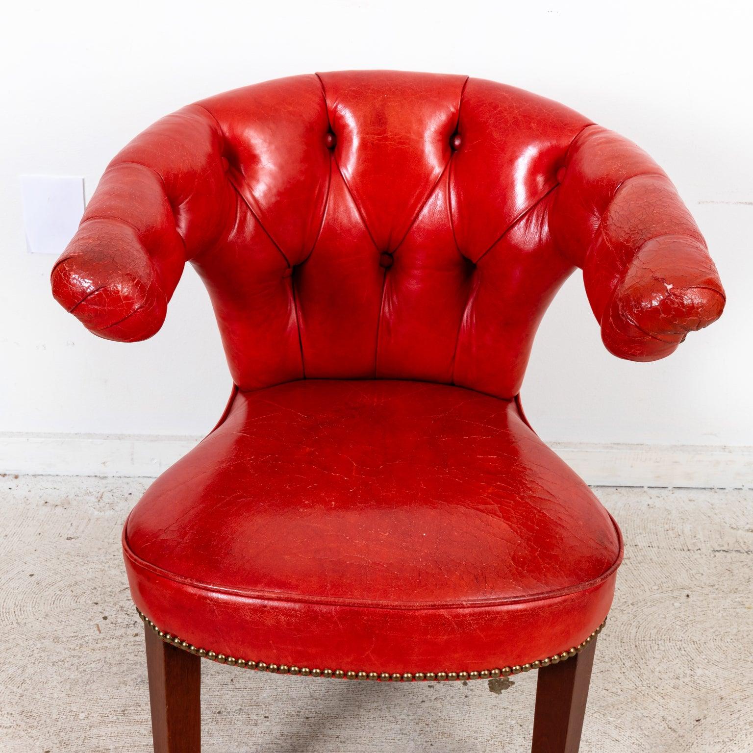 Circa 19th century English leather cockfighting chair with tufted seat back, block turned legs, and metal nail head trim. Please note of wear consistent with age including wear to the leather. 
 