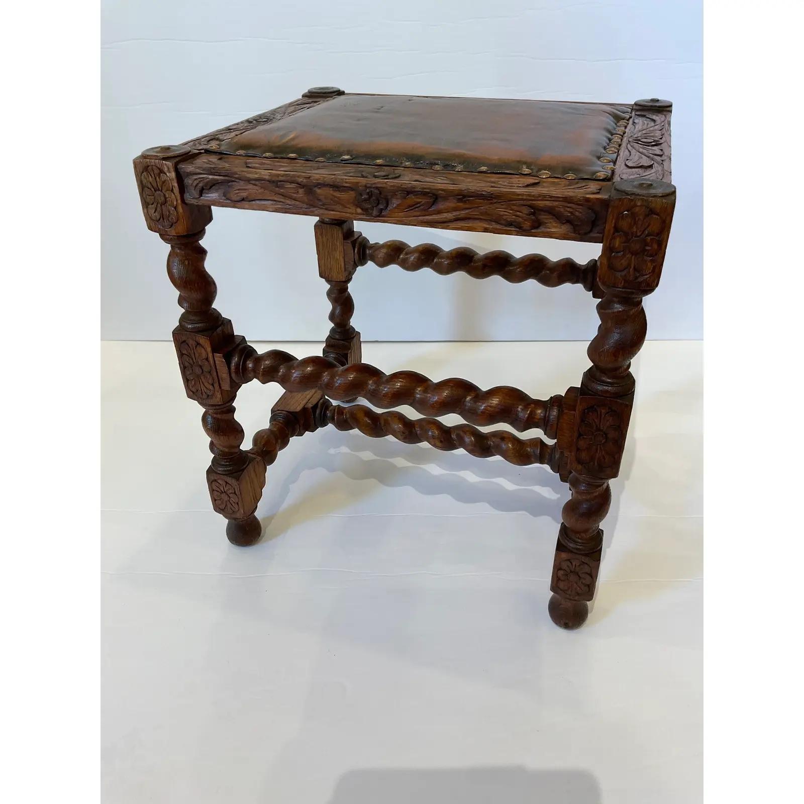 This is a beautiful 19th Century English hand carved leather top stool. The old leather along with the barley leg gives this item great appeal from a living room to office space.

Dimensions
18ʺW × 16ʺD × 19ʺH